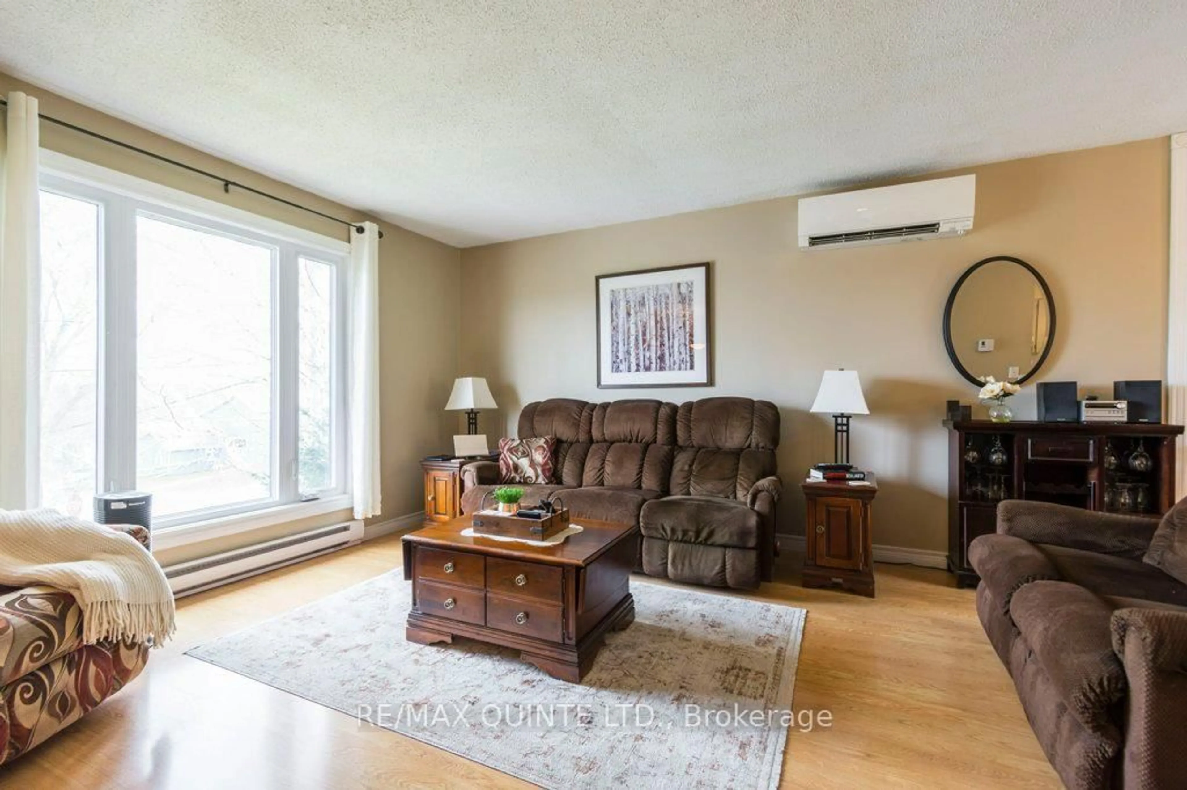Living room with furniture, wood/laminate floor for 3 Cumberland St, Prince Edward County Ontario K0K 2T0