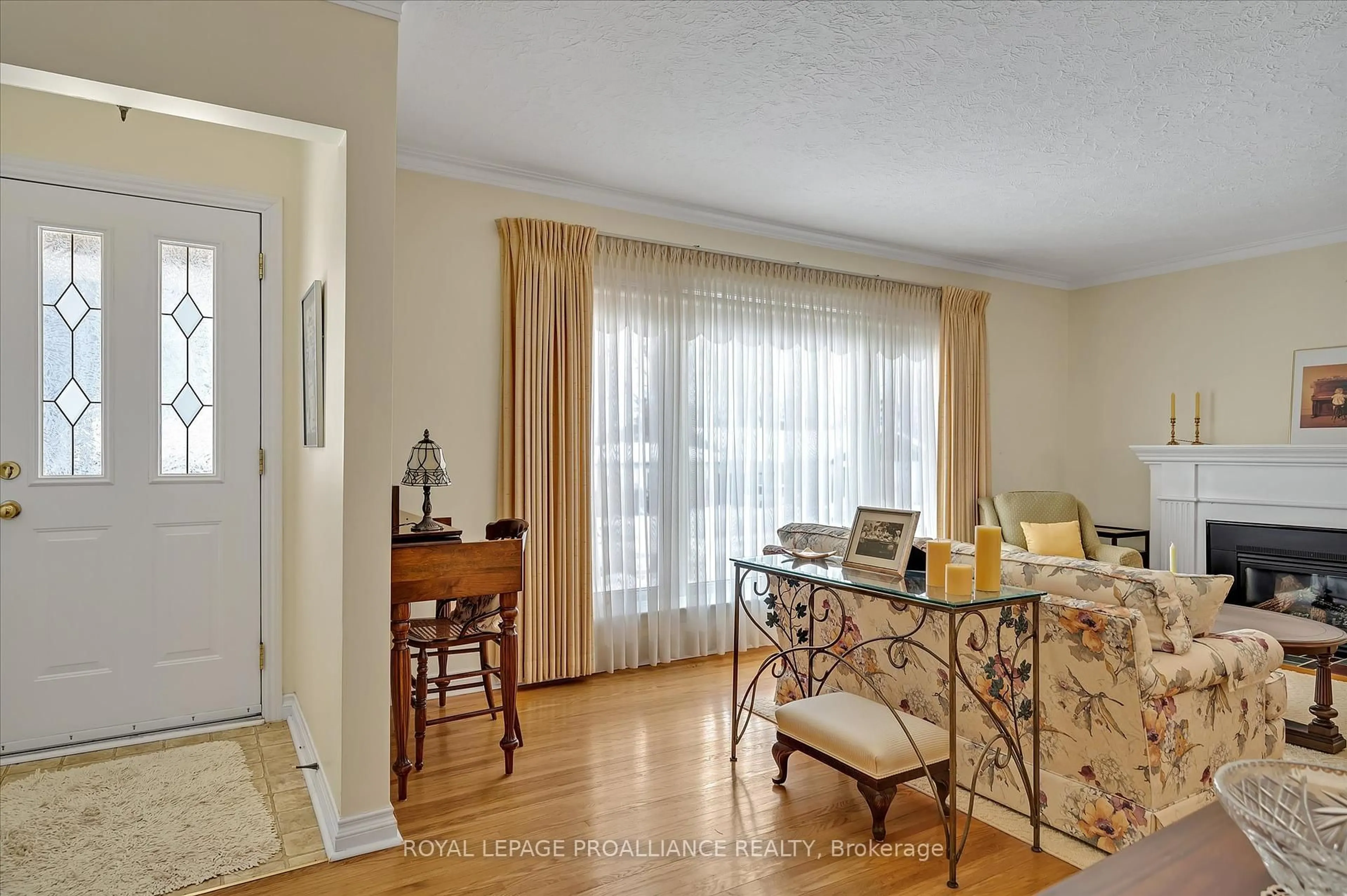 Living room with furniture, wood/laminate floor for 114 O'Carroll Ave, Peterborough North Ontario K9H 4V3