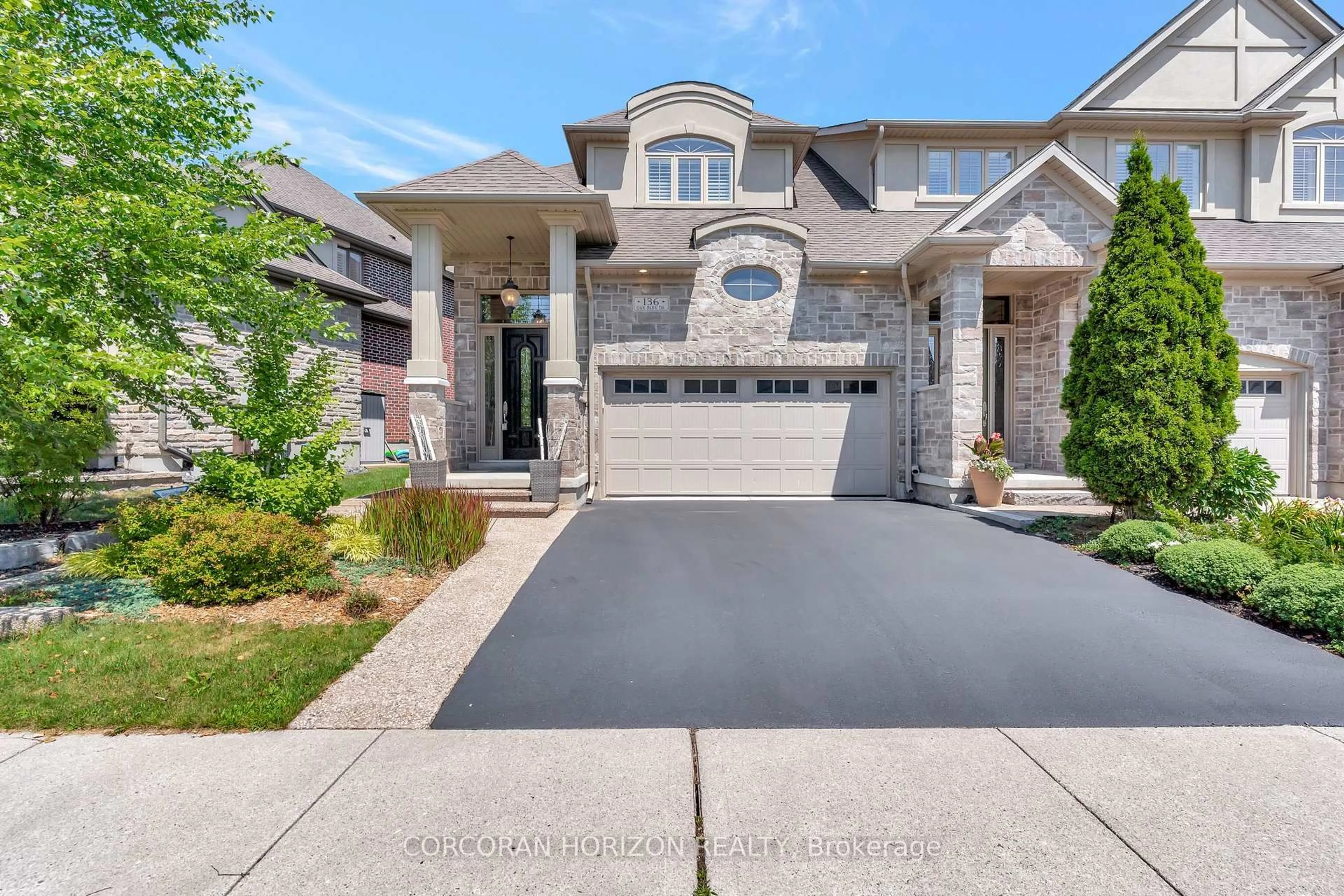 Home with brick exterior material, street for 136 Oak Park Dr, Waterloo Ontario N2K 0B3
