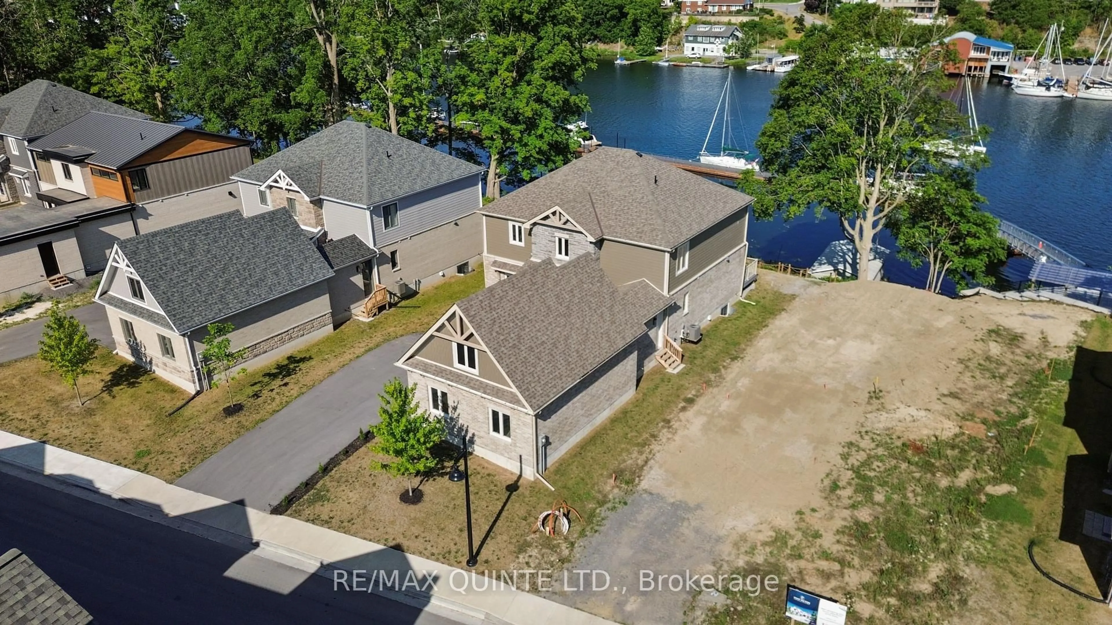 A pic from outside/outdoor area/front of a property/back of a property/a pic from drone, water/lake/river/ocean view for 125 Villeneuve Dr, Prince Edward County Ontario K0K 2T0