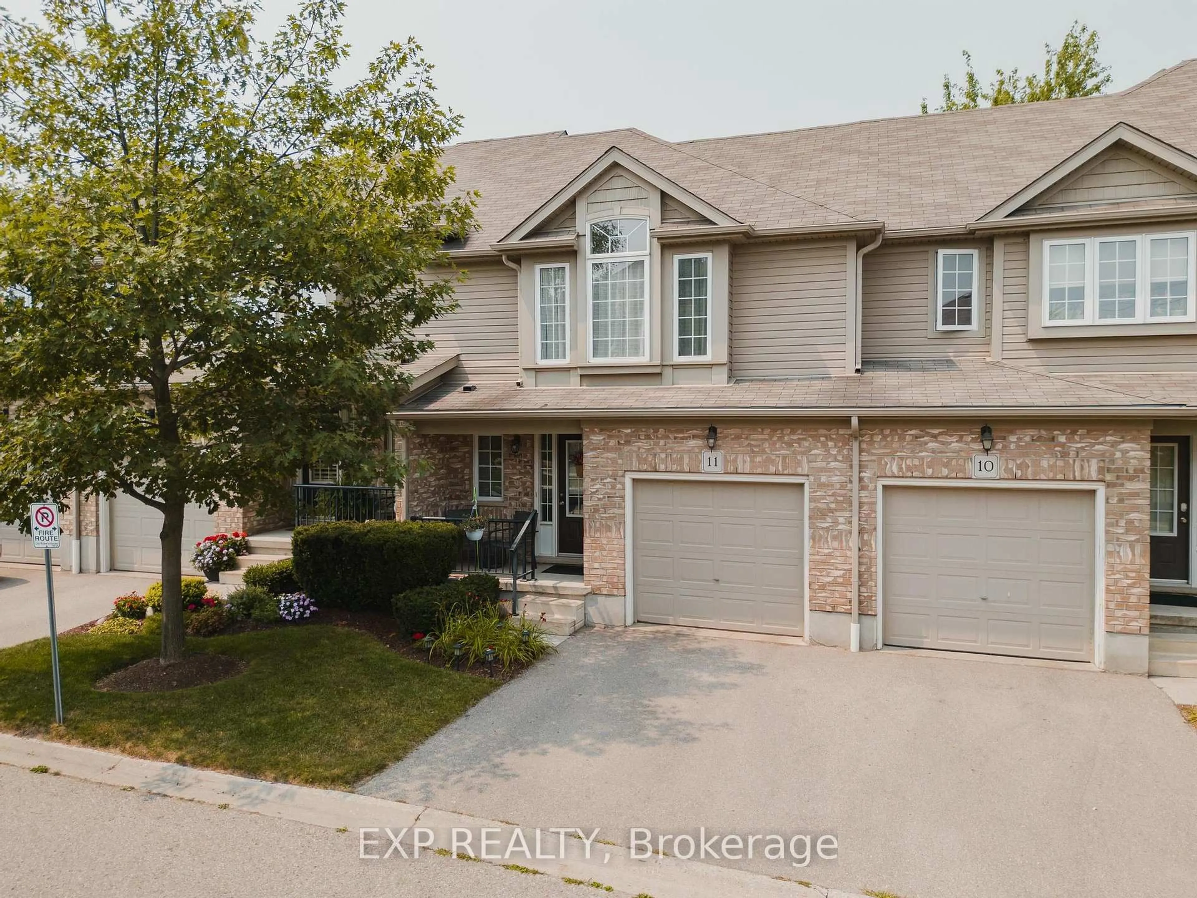 A pic from outside/outdoor area/front of a property/back of a property/a pic from drone, street for 555 Chablis Dr #11, Waterloo Ontario N2T 0A5