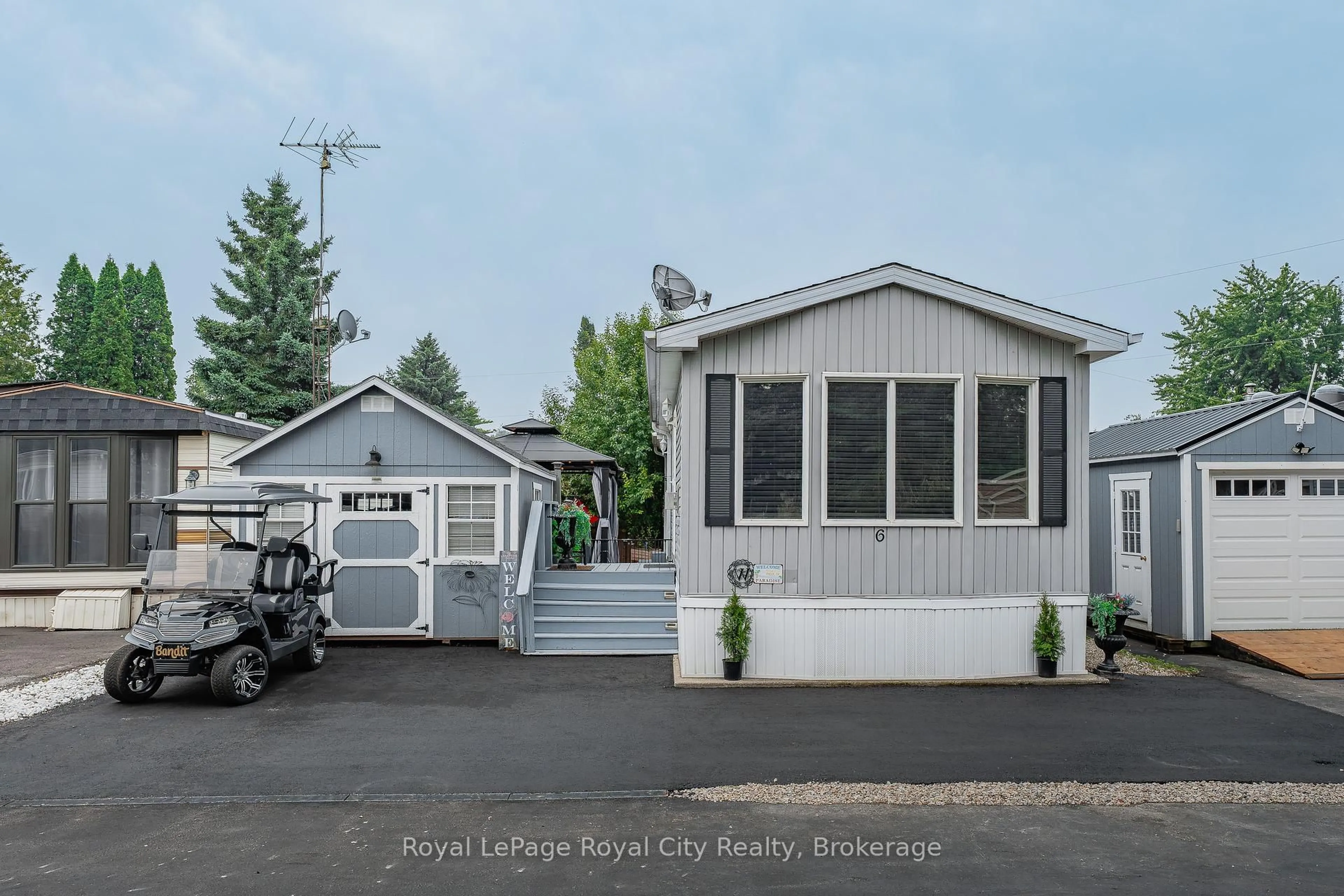 Home with vinyl exterior material, street for 6 Water St, Puslinch Ontario N1H 6H9