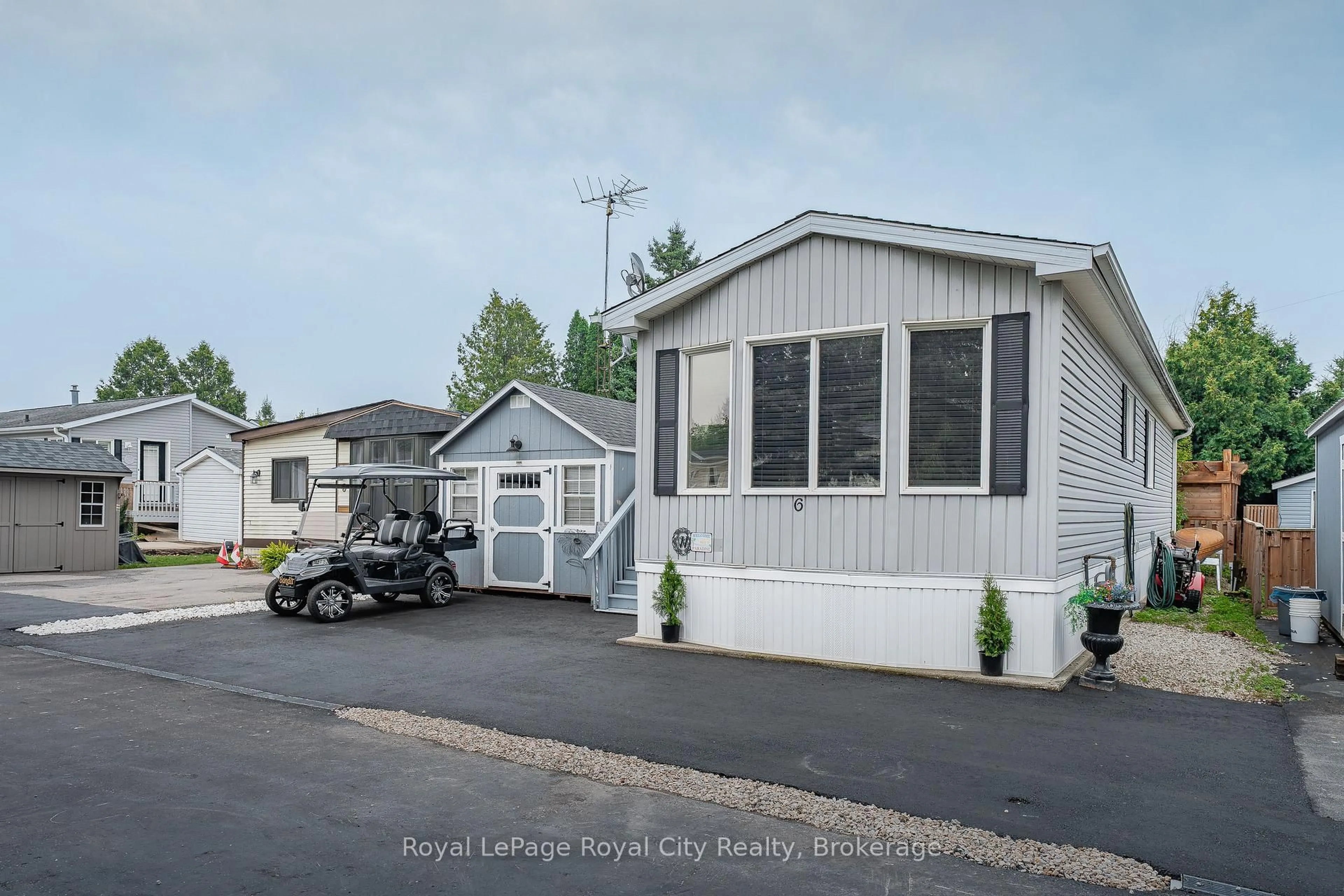 Home with vinyl exterior material, street for 6 Water St, Puslinch Ontario N1H 6H9