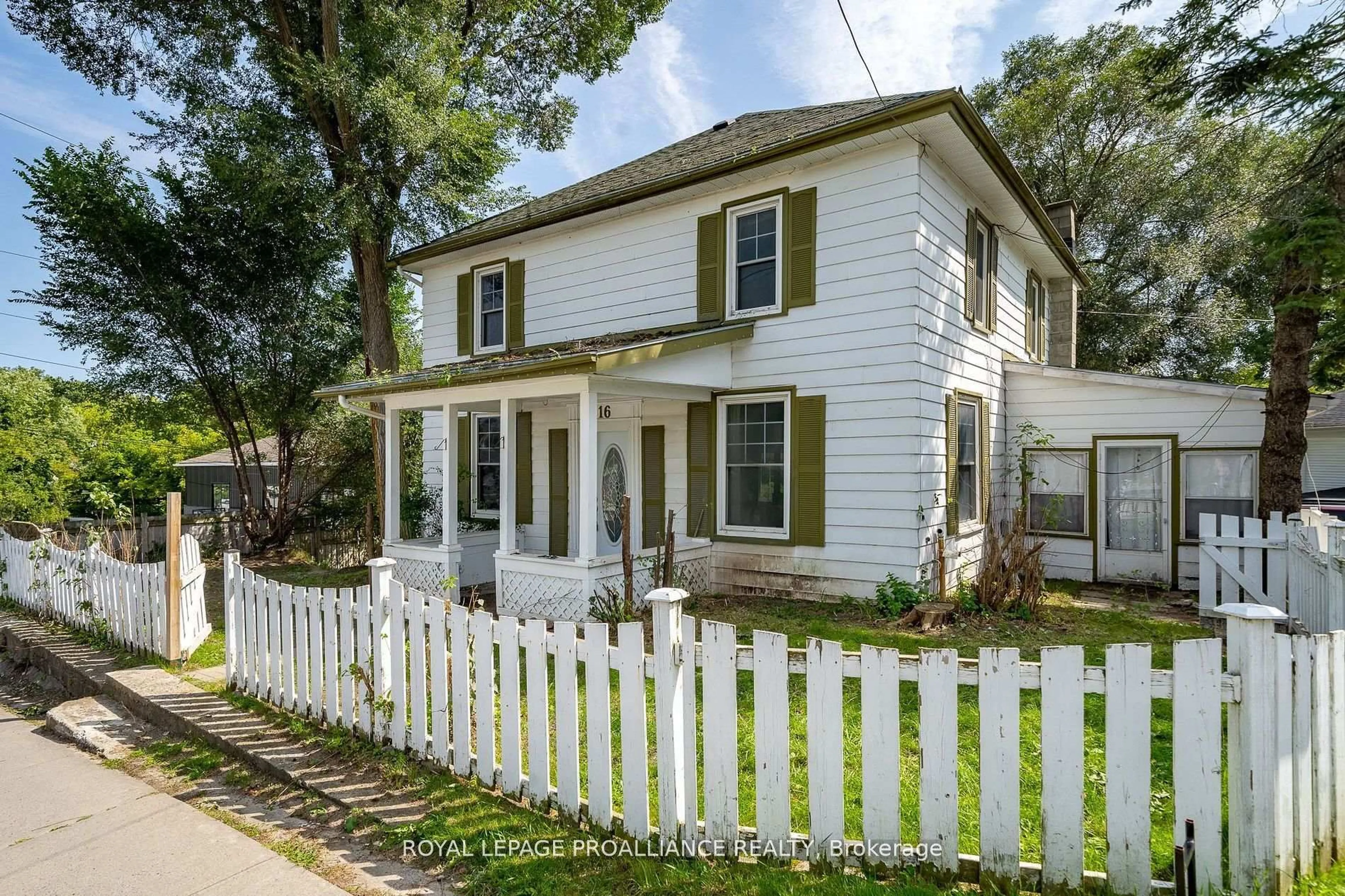 Home with vinyl exterior material, street for 16 Bridge St, Prince Edward County Ontario K0K 2T0