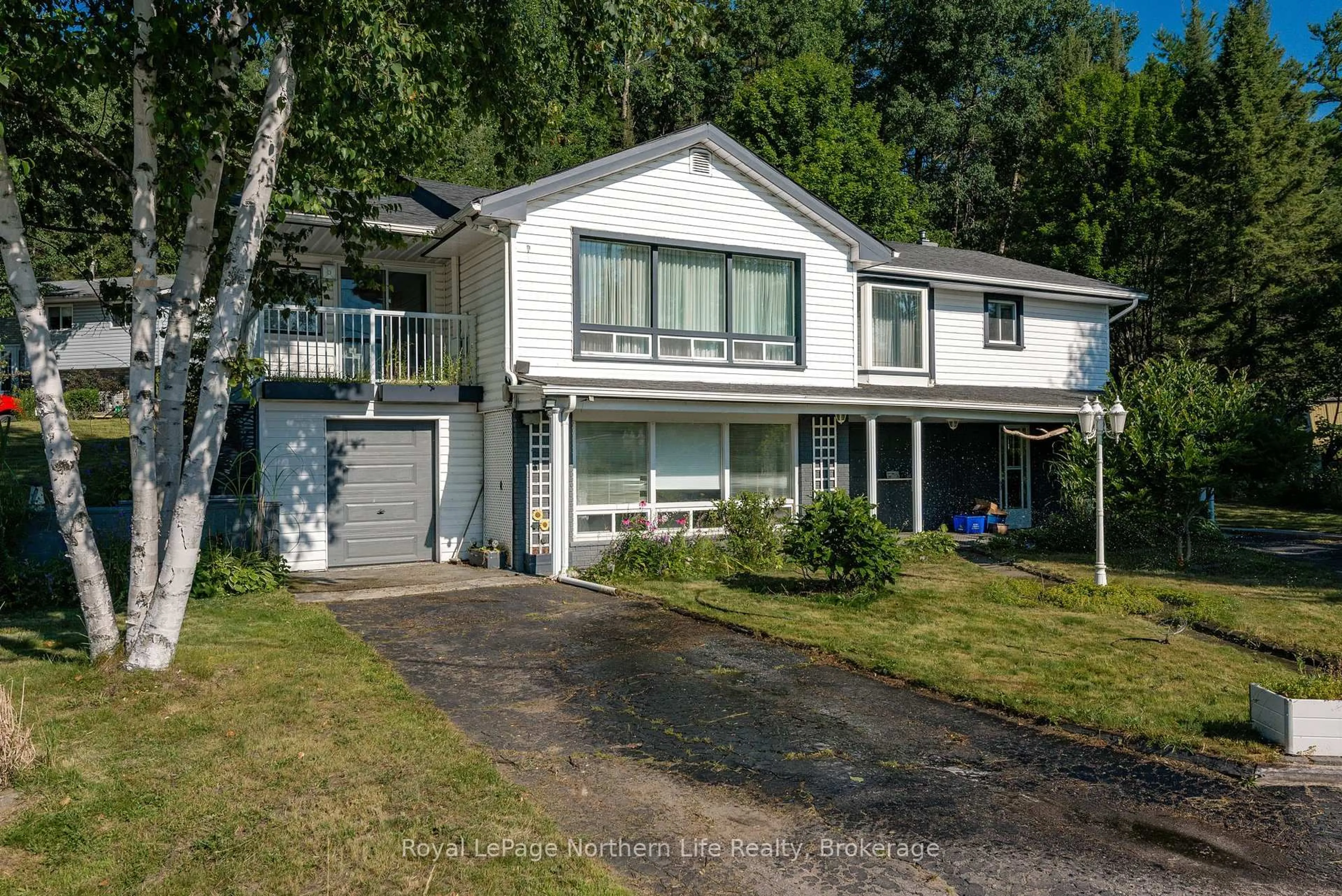 Home with vinyl exterior material, street for 32 Highway 654, Callander Ontario P0H 1H0