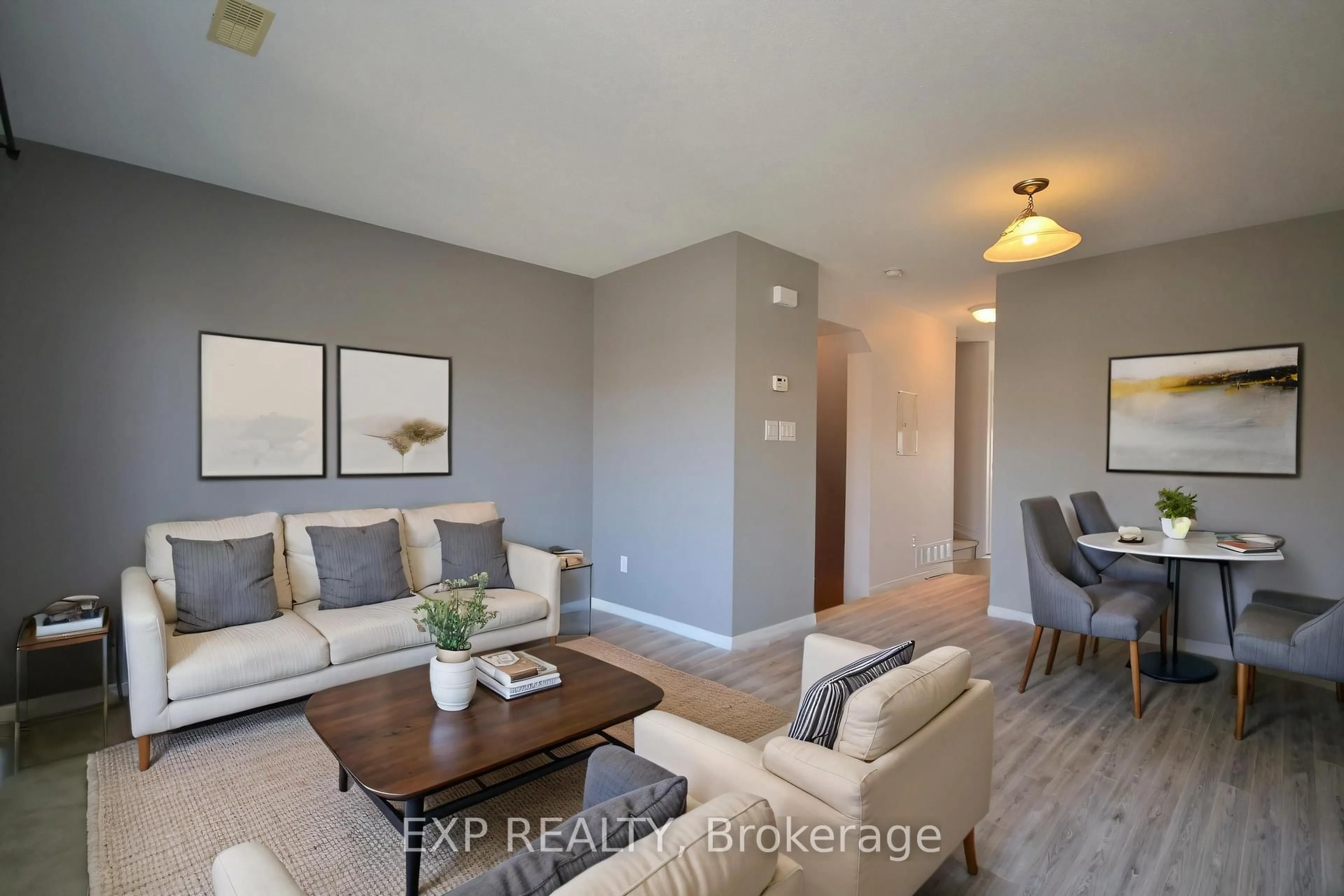 Living room with furniture, wood/laminate floor for 162 Urbancrest Private #57, Ottawa Ontario K2J 2S7