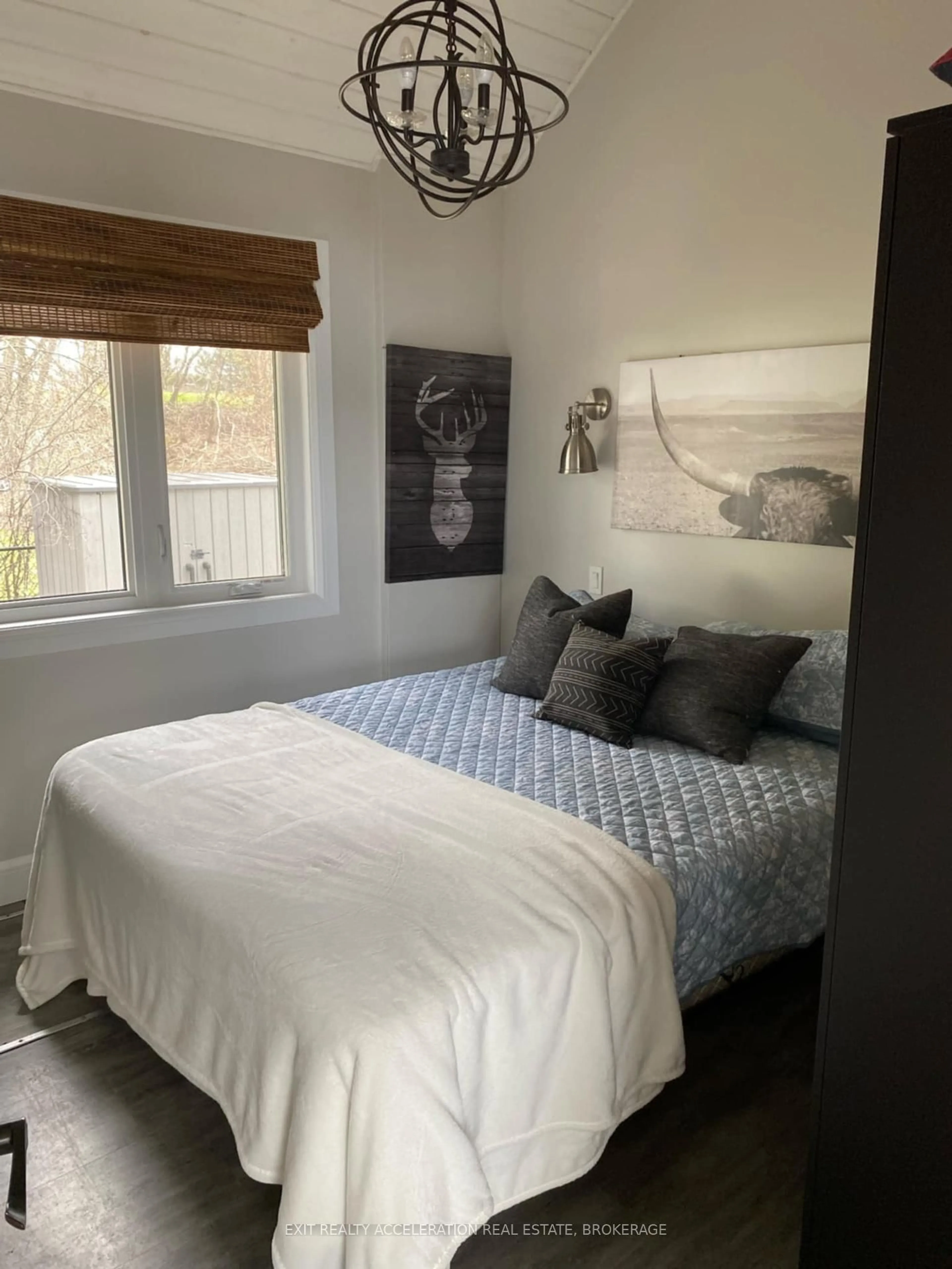 Bedroom with bed, wood/laminate floor for 2119 B County Rd 9, Napanee Ontario K7R 3K8