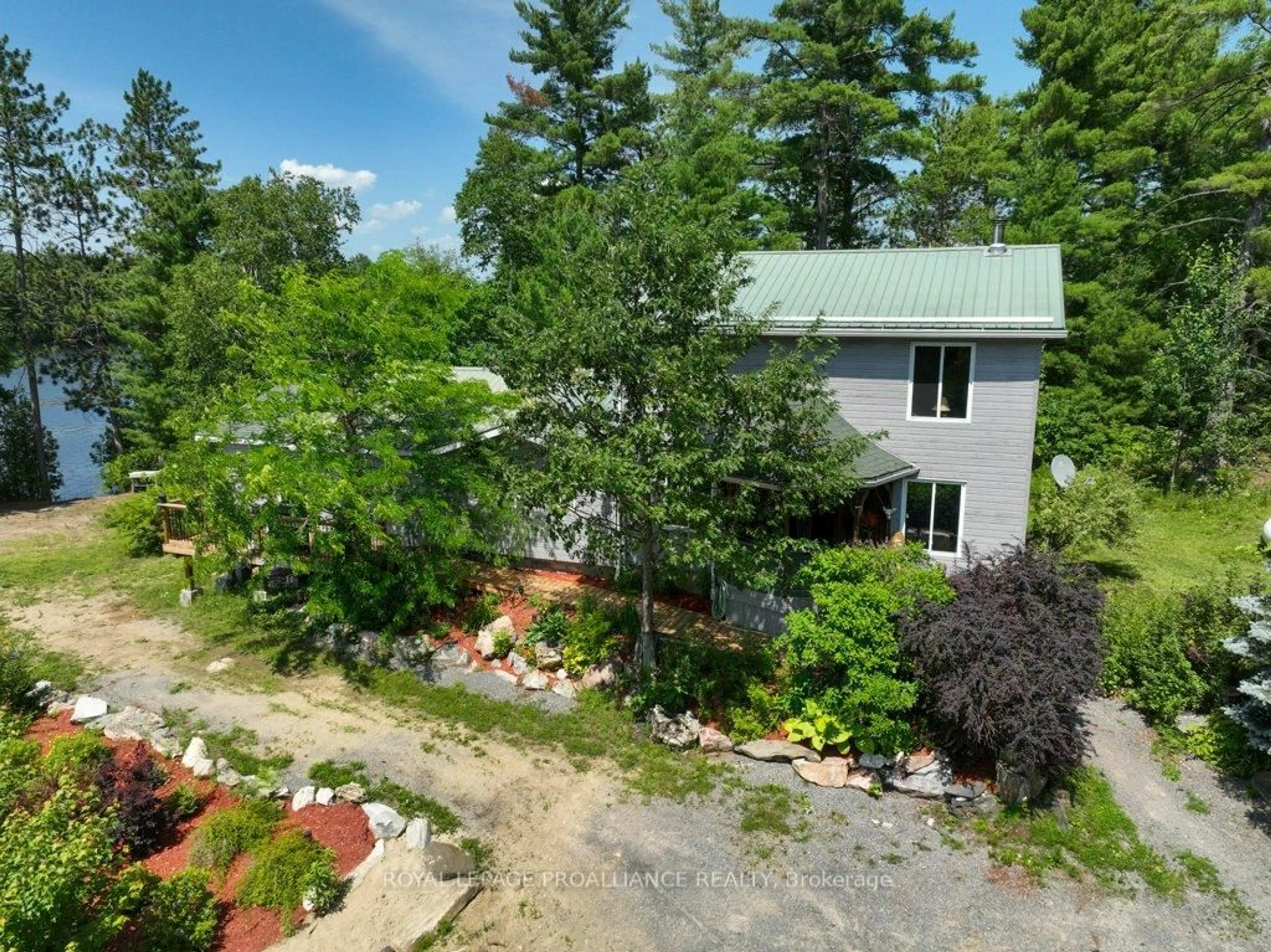 A pic from outside/outdoor area/front of a property/back of a property/a pic from drone, unknown for 2475 Alf's Bay Lane, Arden Ontario K0H 1B0