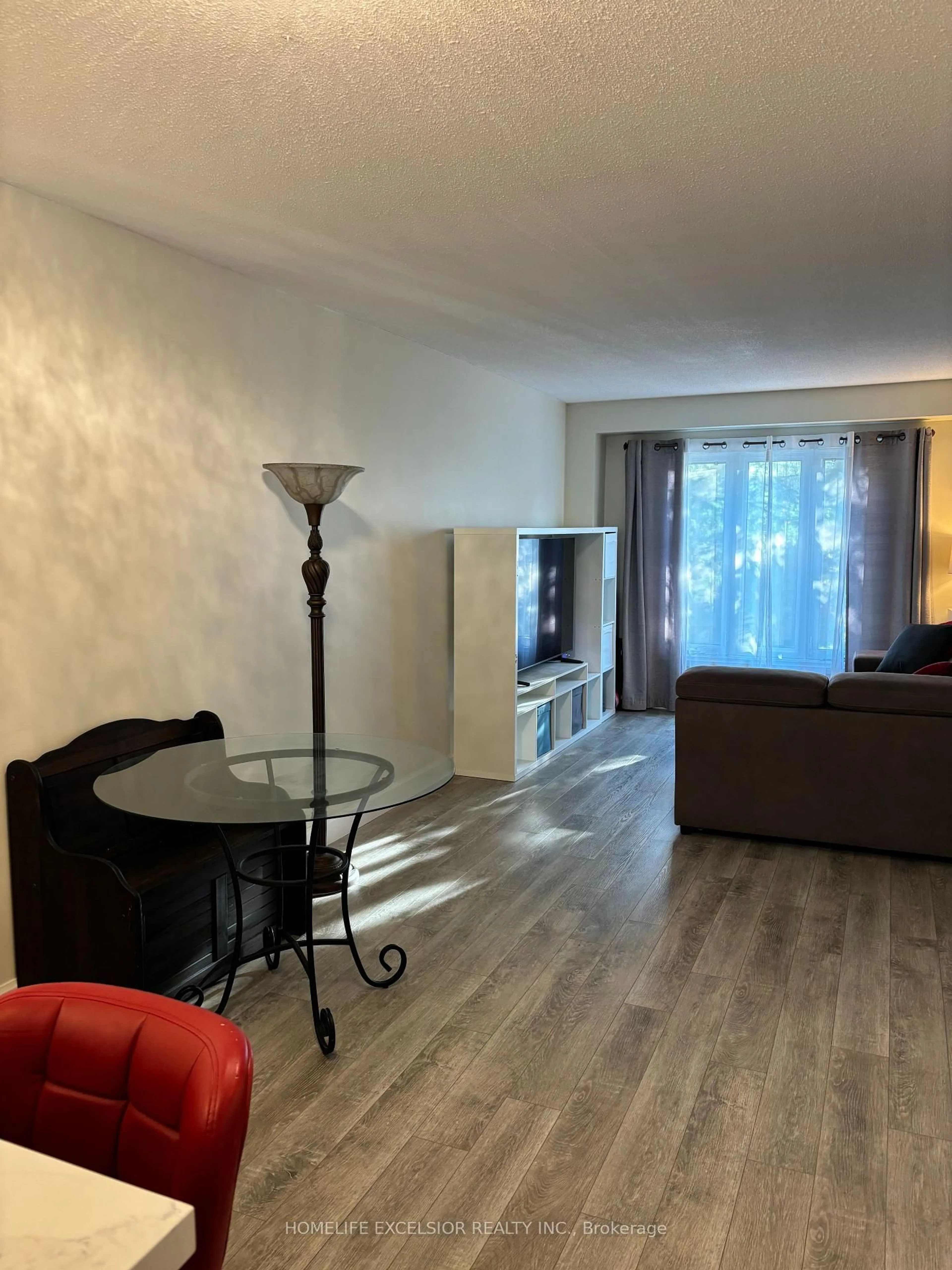 Living room with furniture, wood/laminate floor for 89 Dovercliffe Rd, Guelph Ontario N1G 3A5