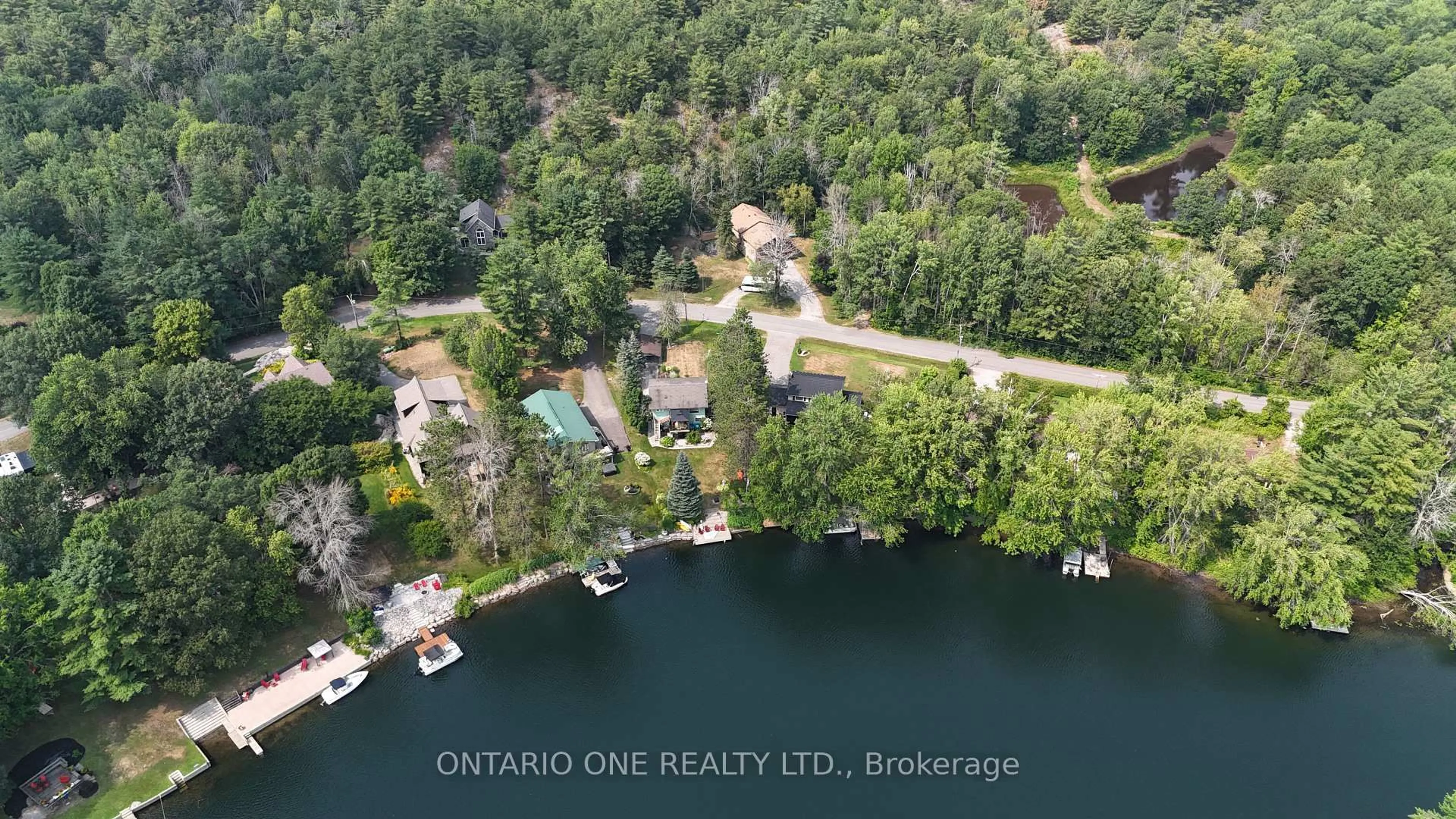A pic from outside/outdoor area/front of a property/back of a property/a pic from drone, water/lake/river/ocean view for 1045 Cowbell Lane, Gravenhurst Ontario P0E 1N0
