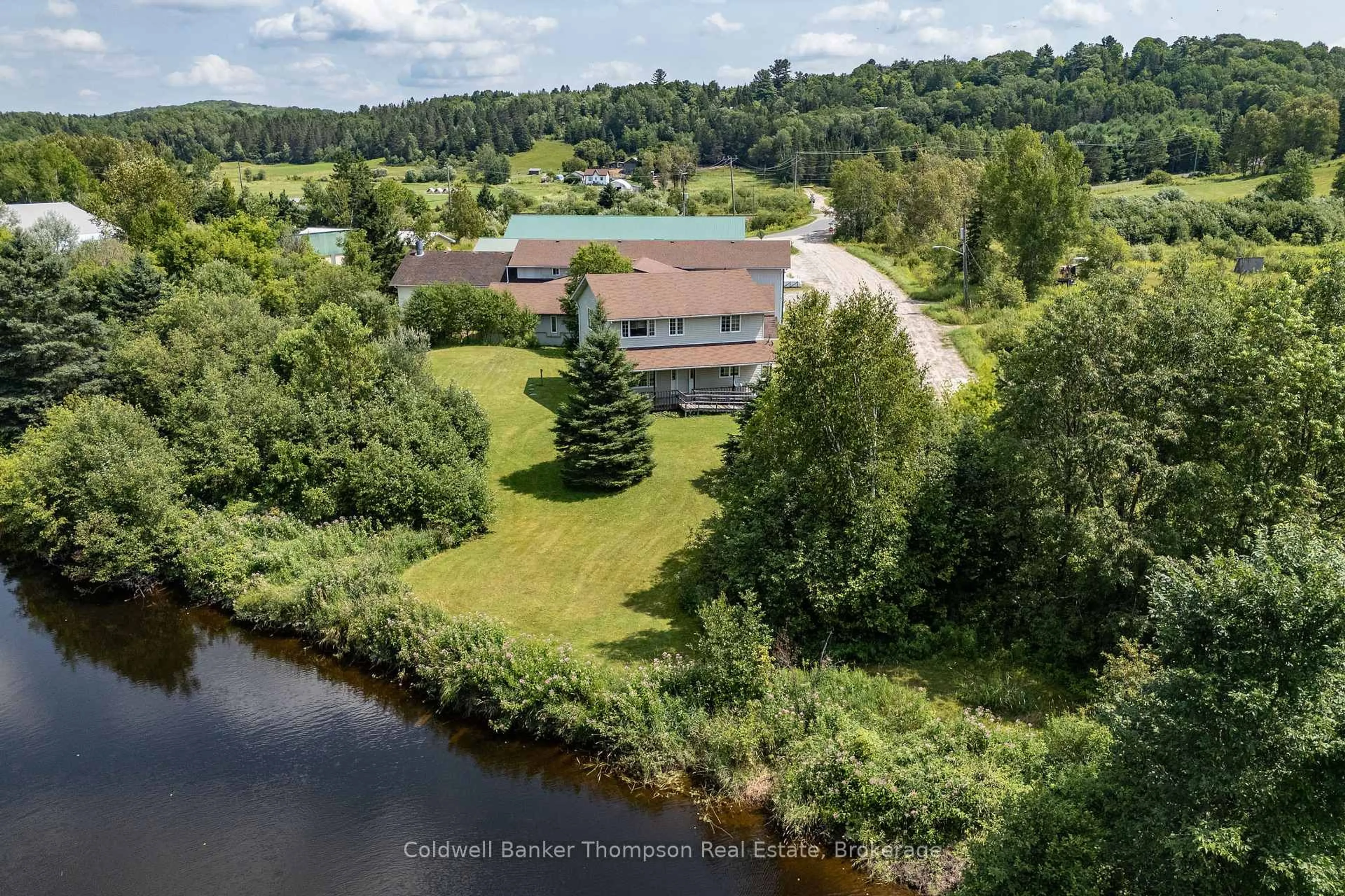 A pic from outside/outdoor area/front of a property/back of a property/a pic from drone, water/lake/river/ocean view for 565 High St, Burk's Falls Ontario P0A 1C0