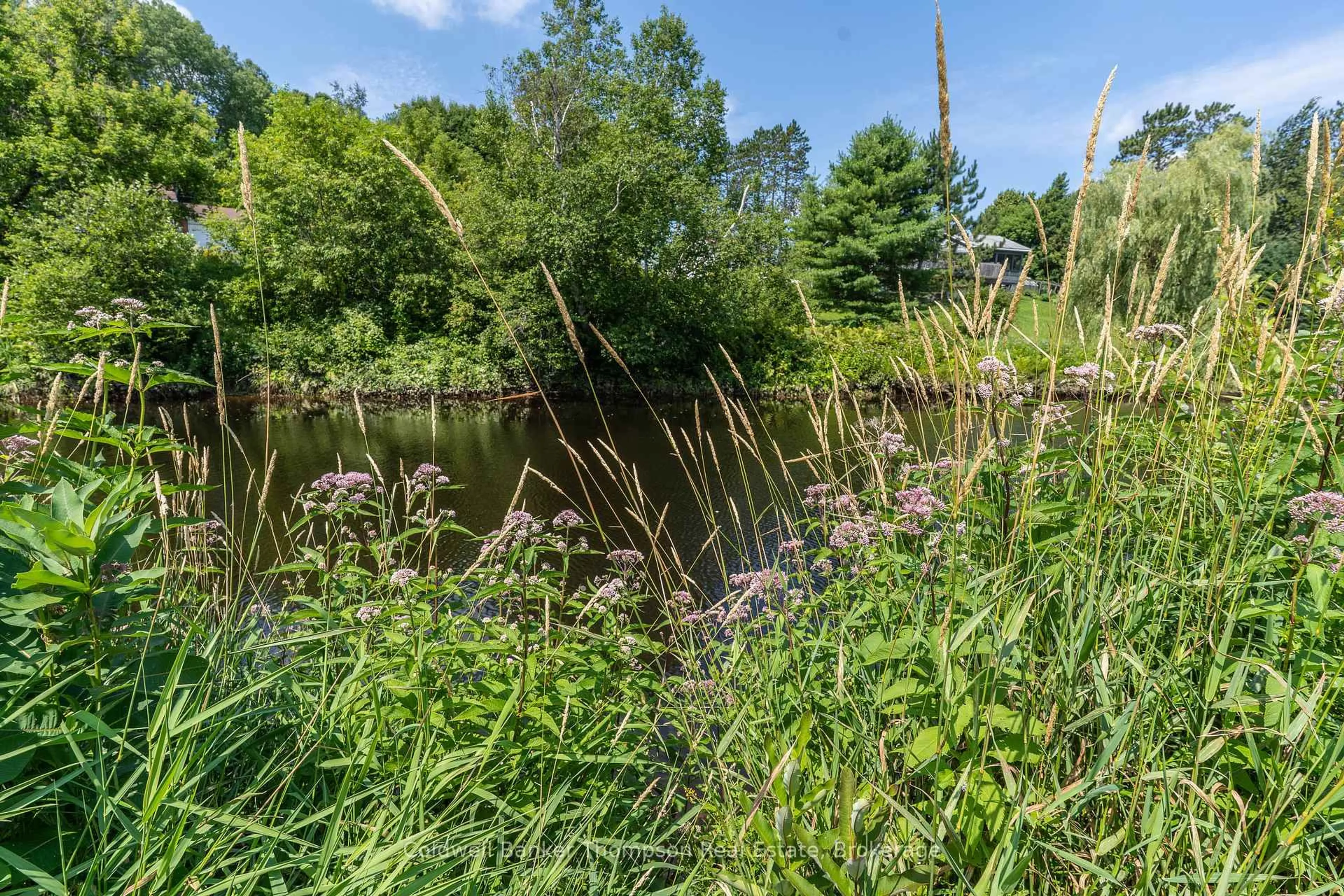 A pic from outside/outdoor area/front of a property/back of a property/a pic from drone, water/lake/river/ocean view for 565 High St, Burk's Falls Ontario P0A 1C0