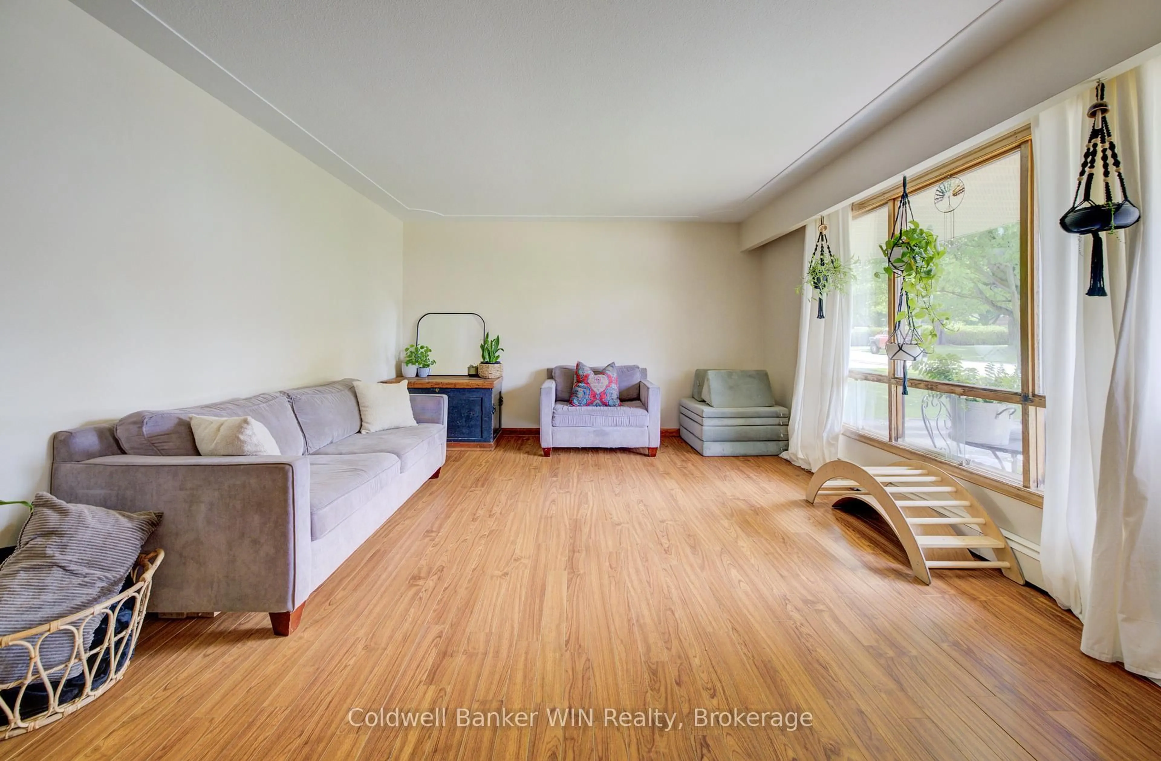 Living room with furniture, wood/laminate floor for 324 Egremont St, Wellington North Ontario N0G 2L2