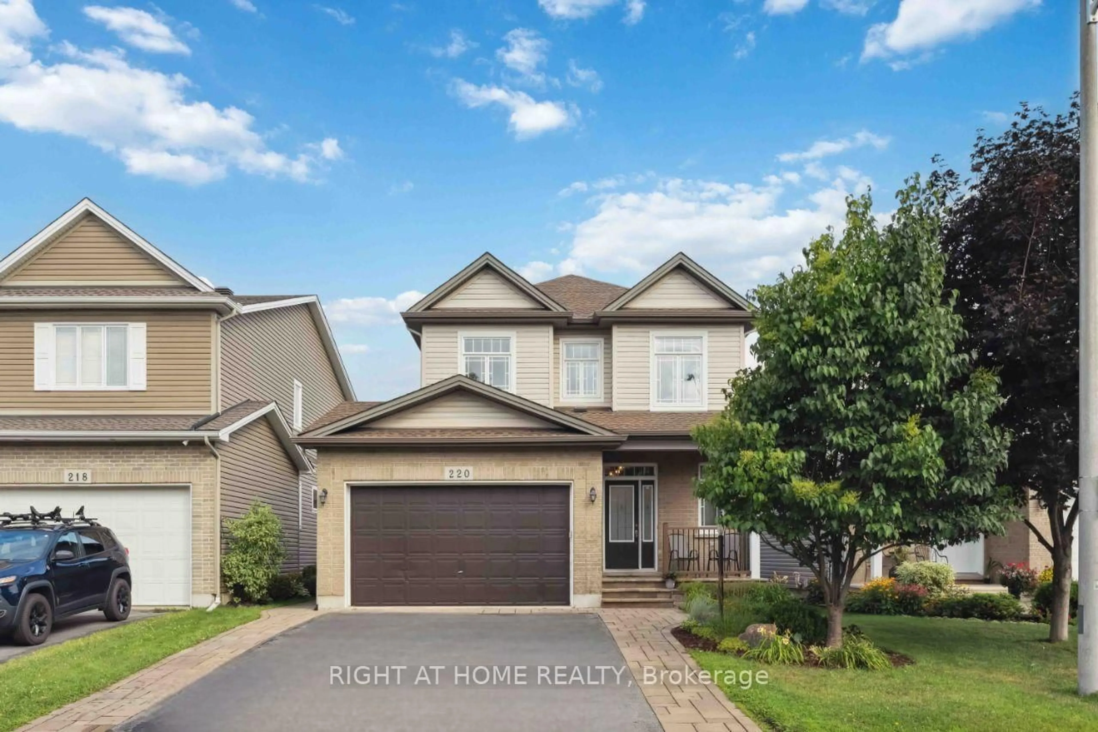 Home with vinyl exterior material, street for 220 Celtic Ridge Cres, Ottawa Ontario K2W 0C1