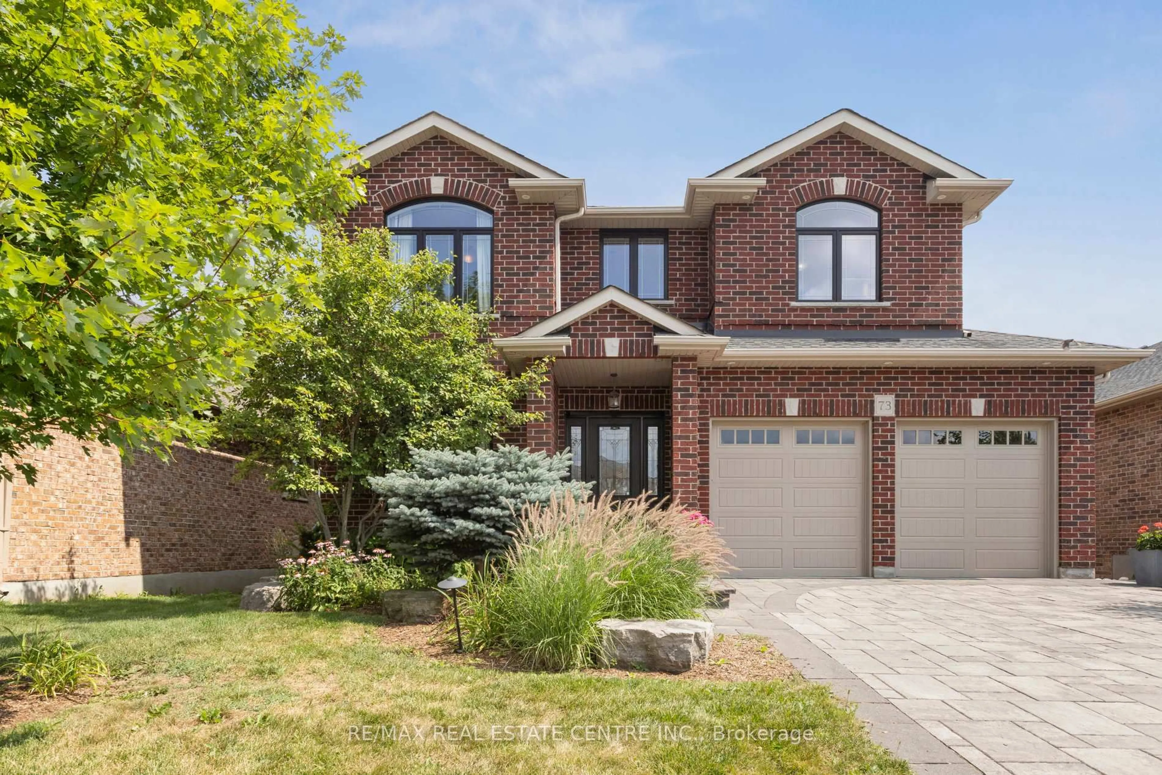 Home with brick exterior material, street for 73 Law Dr, Guelph Ontario N1E 7J6