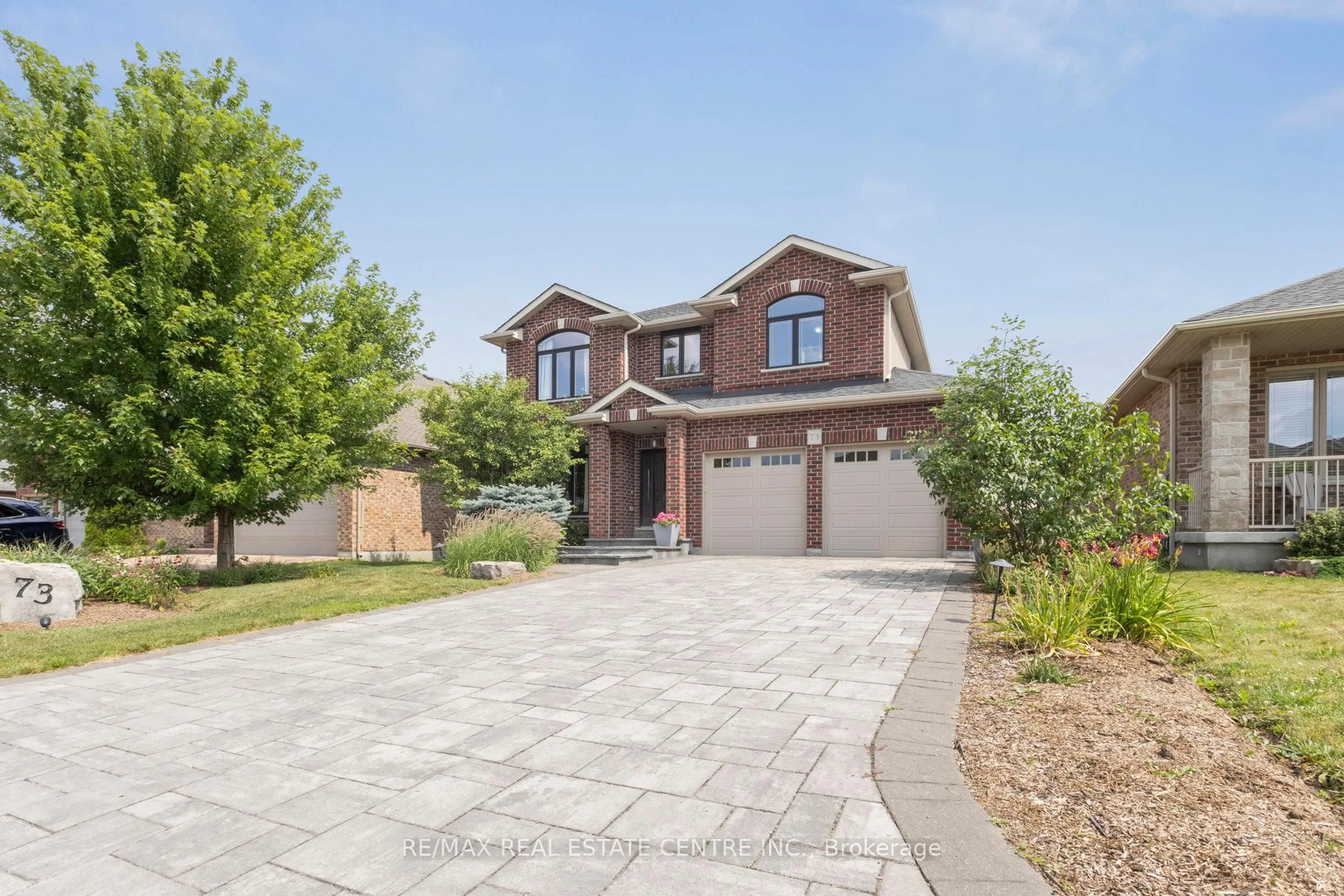 Home with brick exterior material, street for 73 Law Dr, Guelph Ontario N1E 7J6