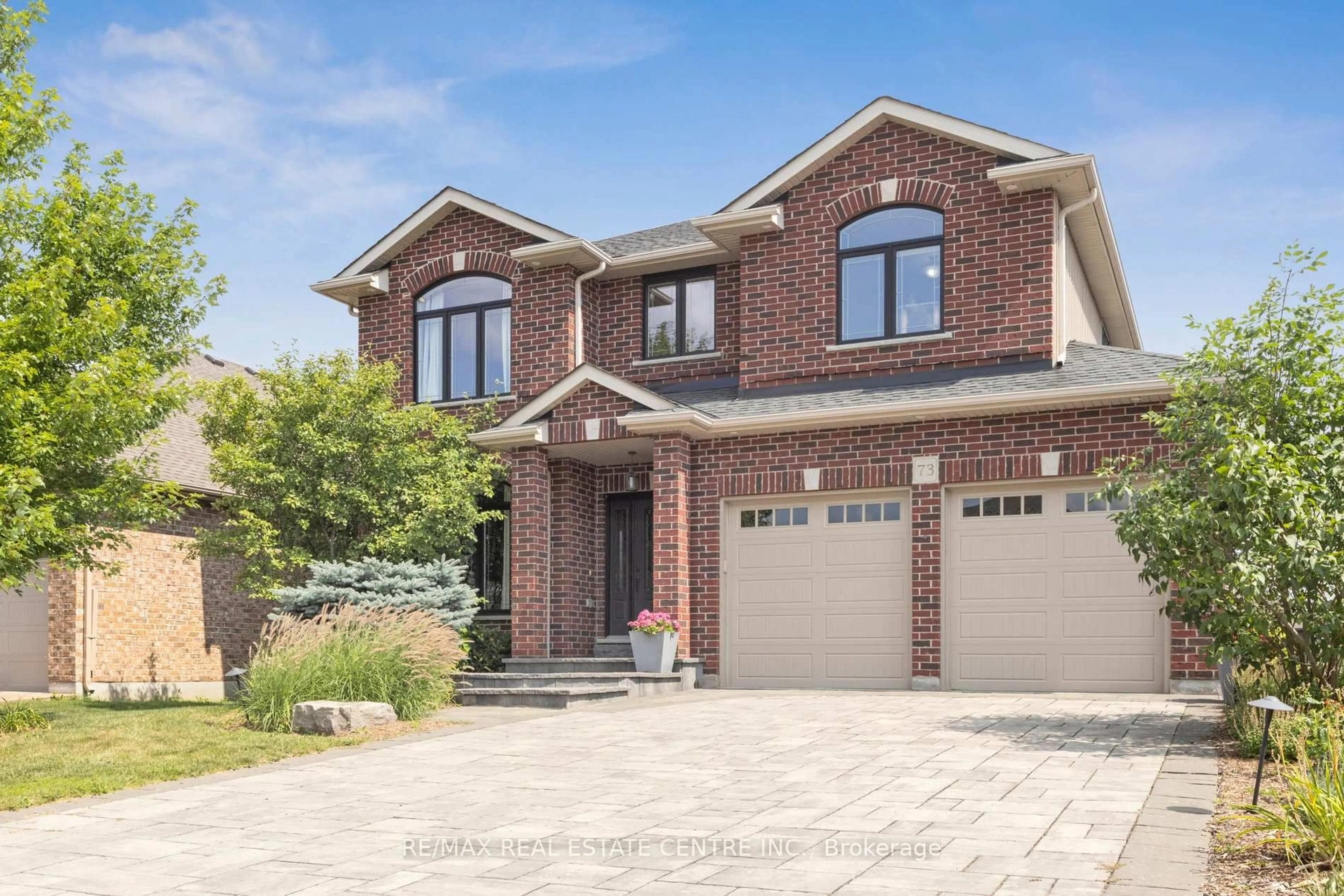 Home with brick exterior material, street for 73 Law Dr, Guelph Ontario N1E 7J6