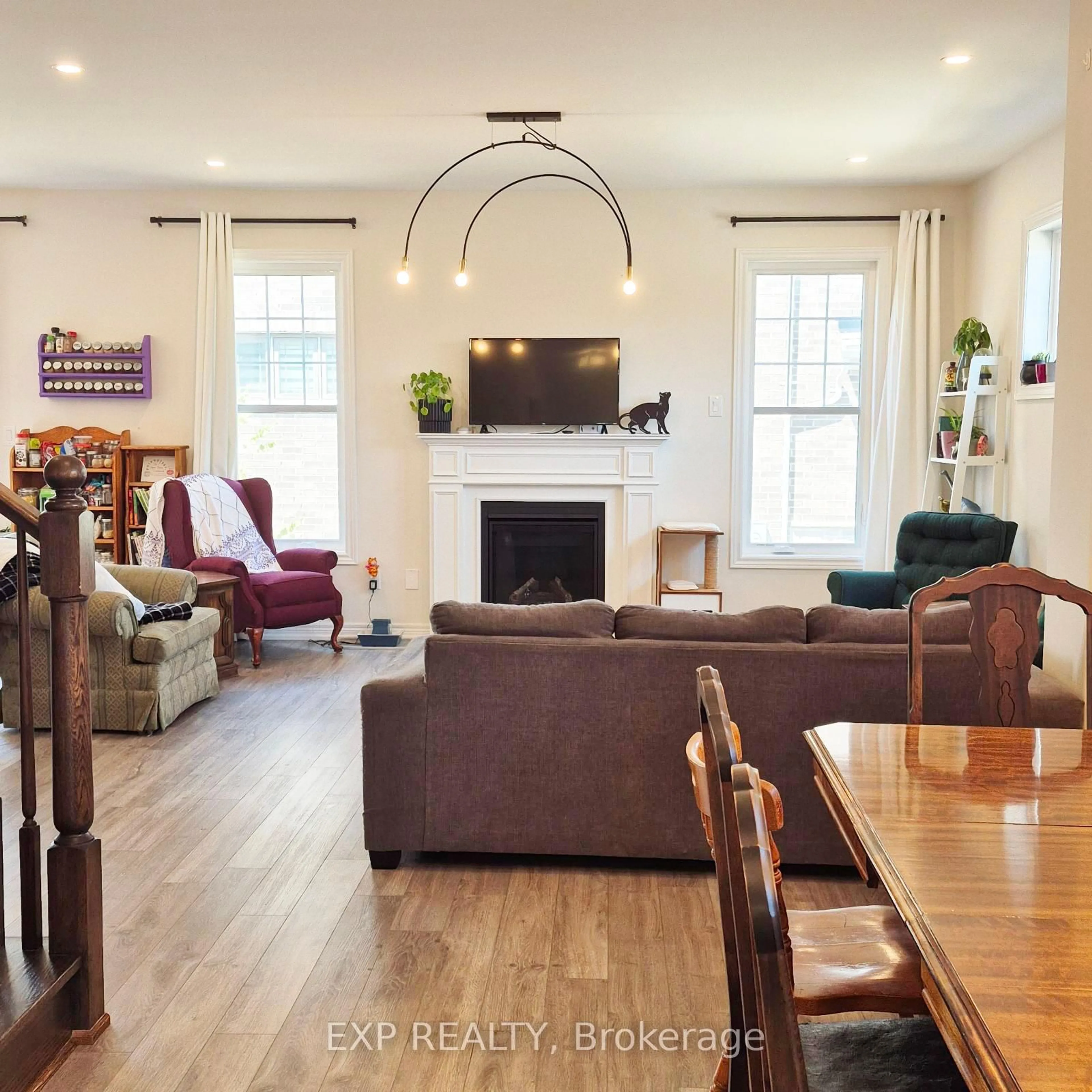 Living room with furniture, wood/laminate floor for 1056 Rippingale Tr, Peterborough North Ontario K9H 0J8