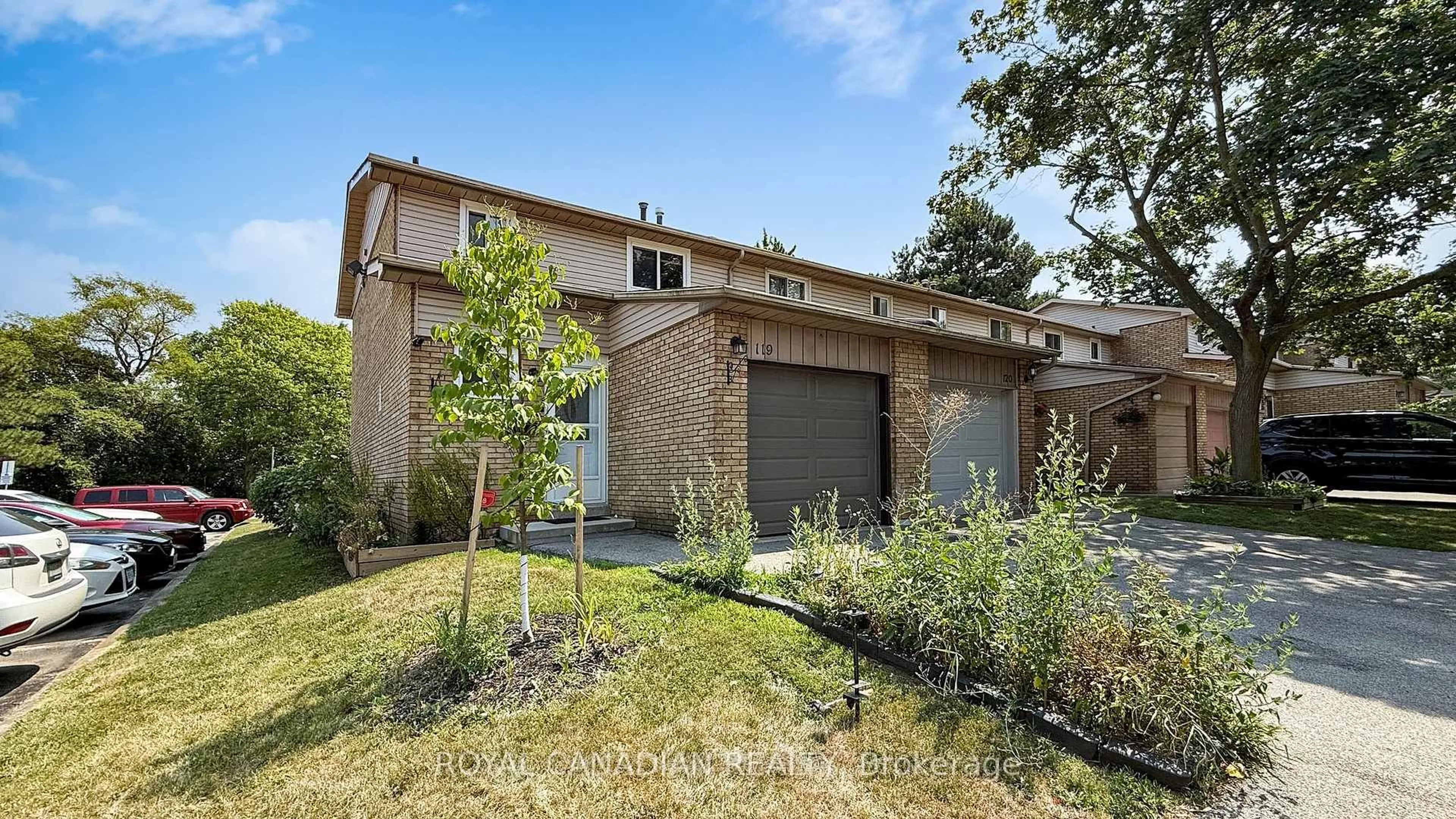 Home with brick exterior material, street for 100 Quigley Rd #119, Hamilton Ontario L8K 6J1