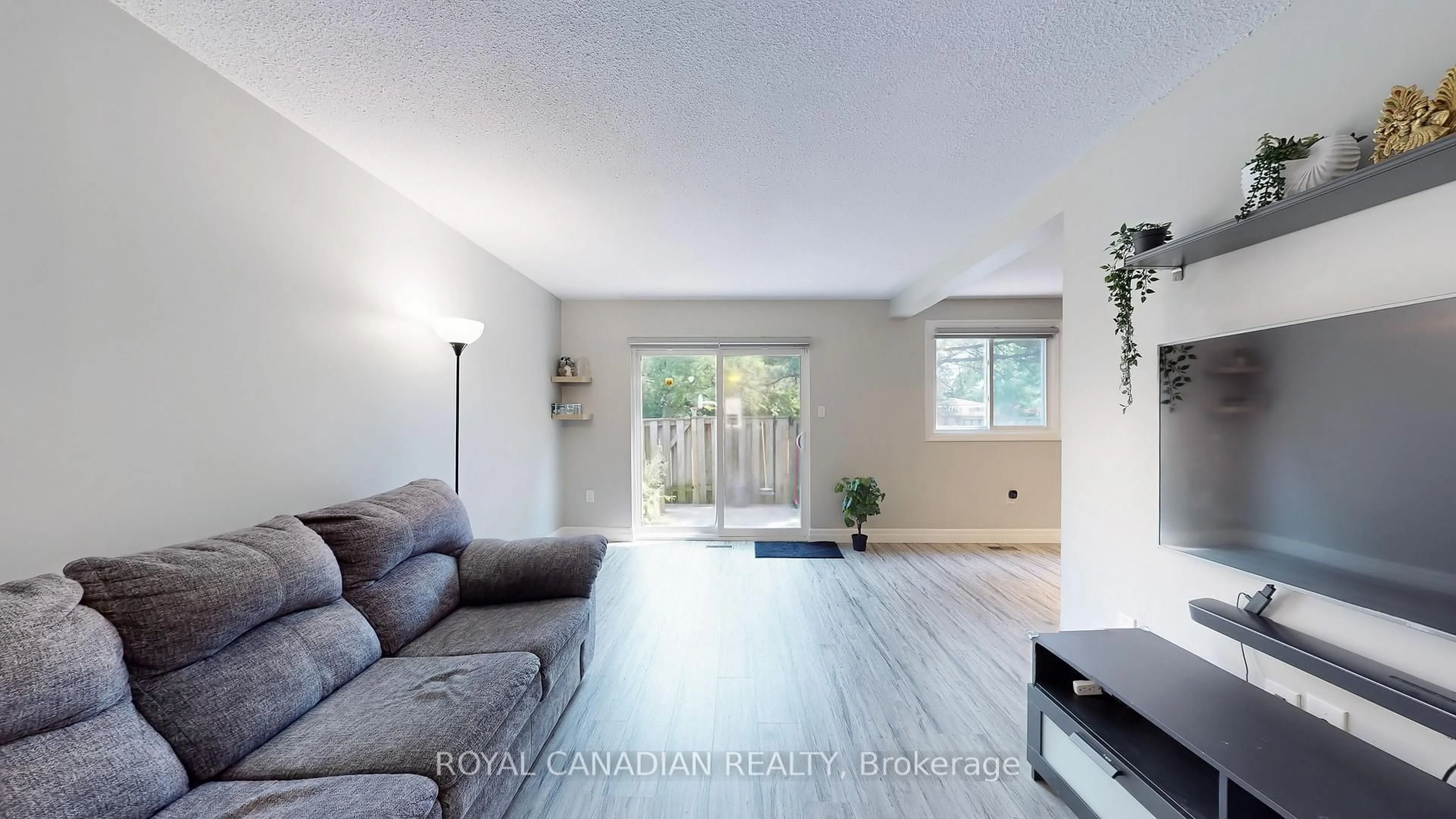 Living room with furniture, unknown for 100 Quigley Rd #119, Hamilton Ontario L8K 6J1