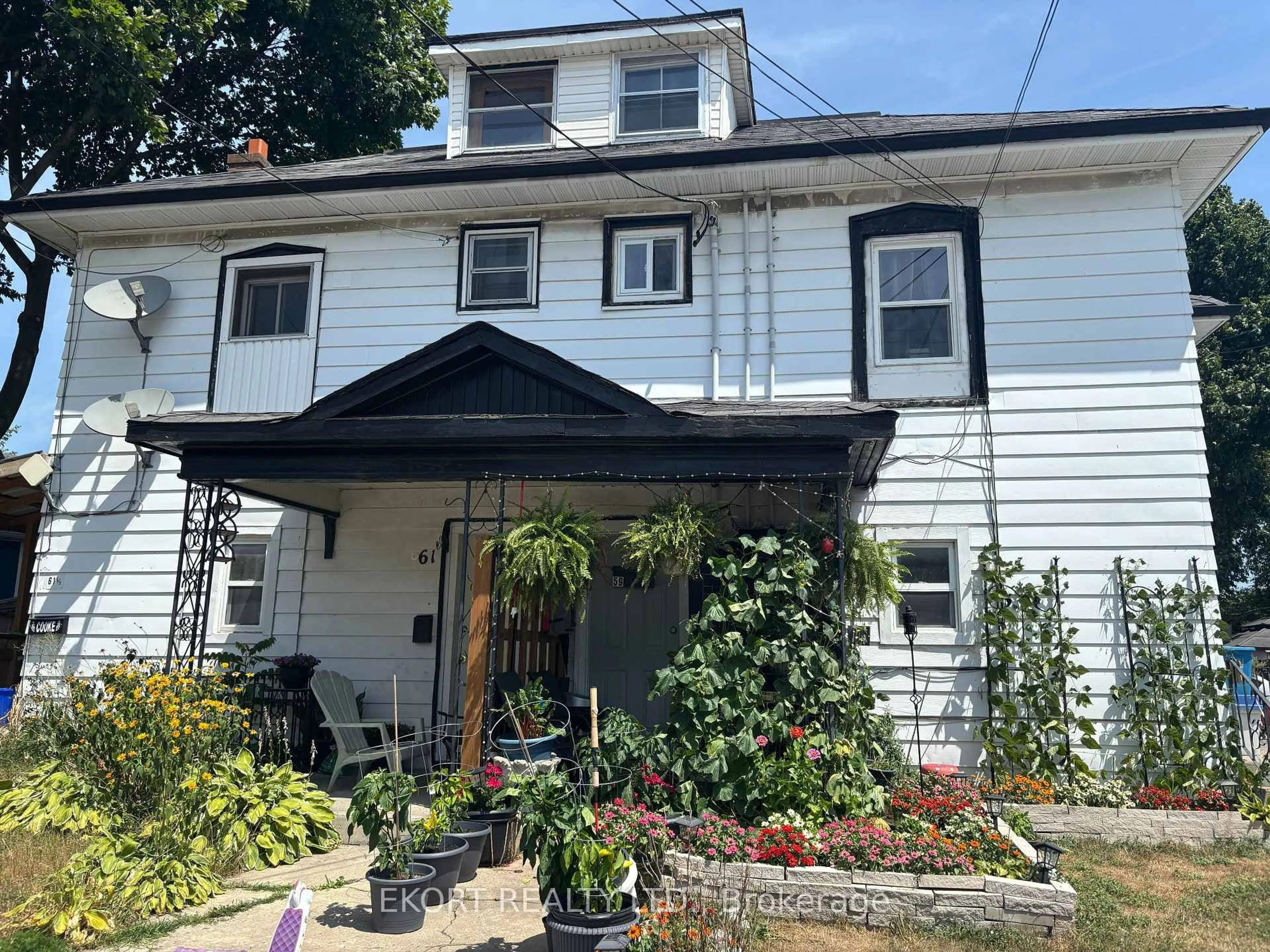 Home with vinyl exterior material, street for 59-61 St Charles St, Belleville Ontario K8P 2W1
