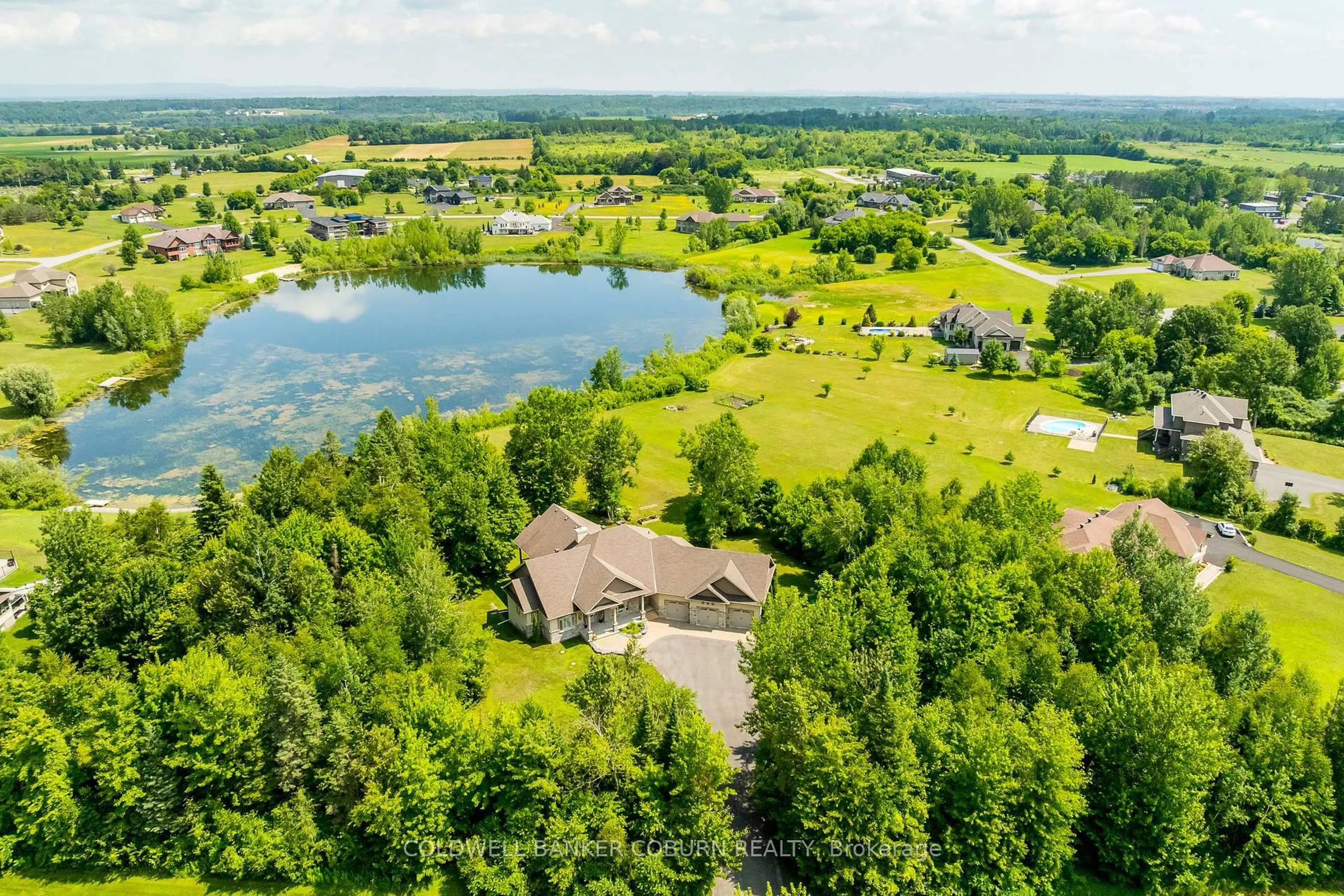 A pic from outside/outdoor area/front of a property/back of a property/a pic from drone, water/lake/river/ocean view for 515 West Lake Circ, Carp Ontario K0A 1L0