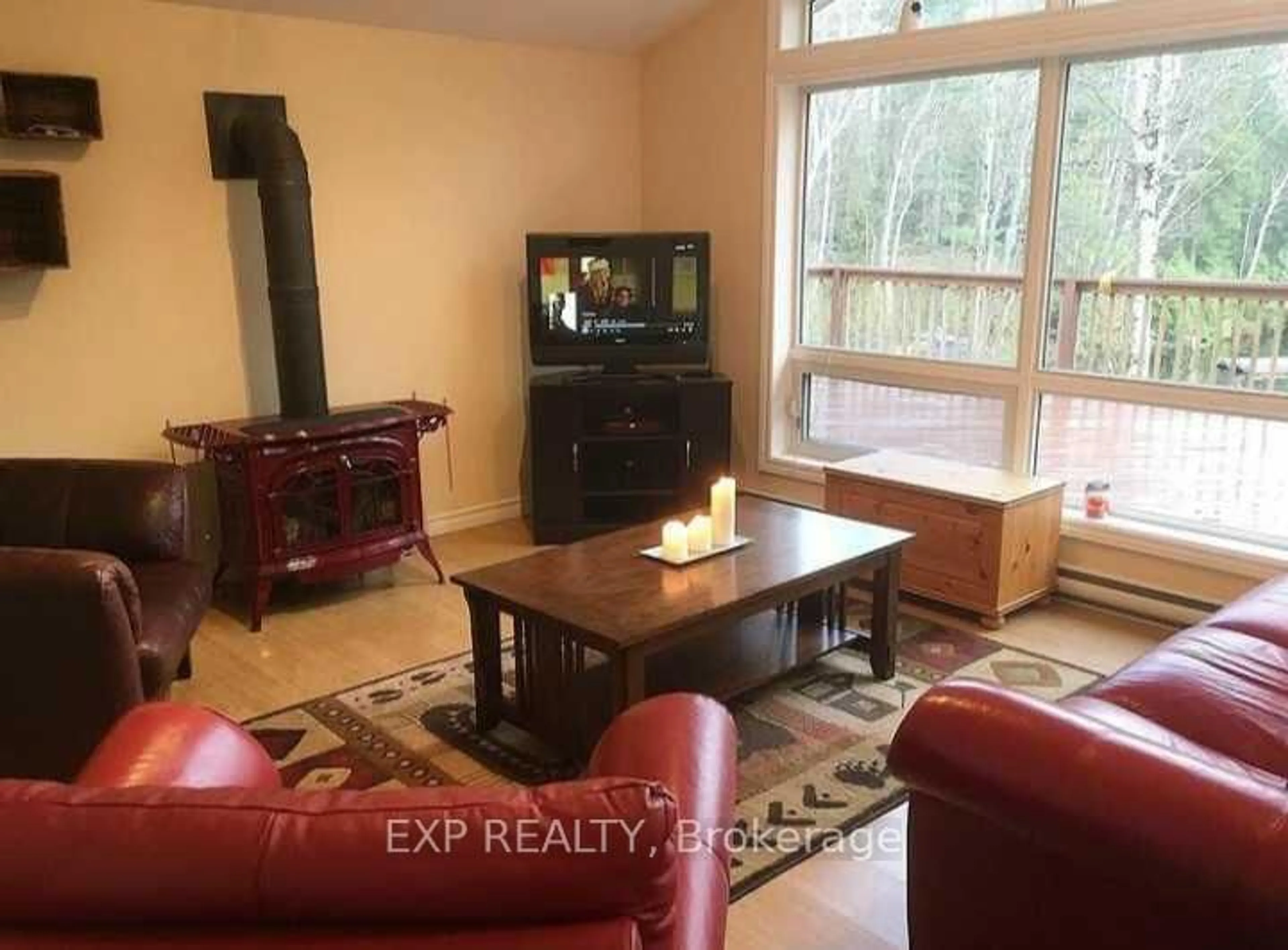 Living room with furniture, wood/laminate floor for 204 Jennison Rd, Hastings Ontario K0L 1W0