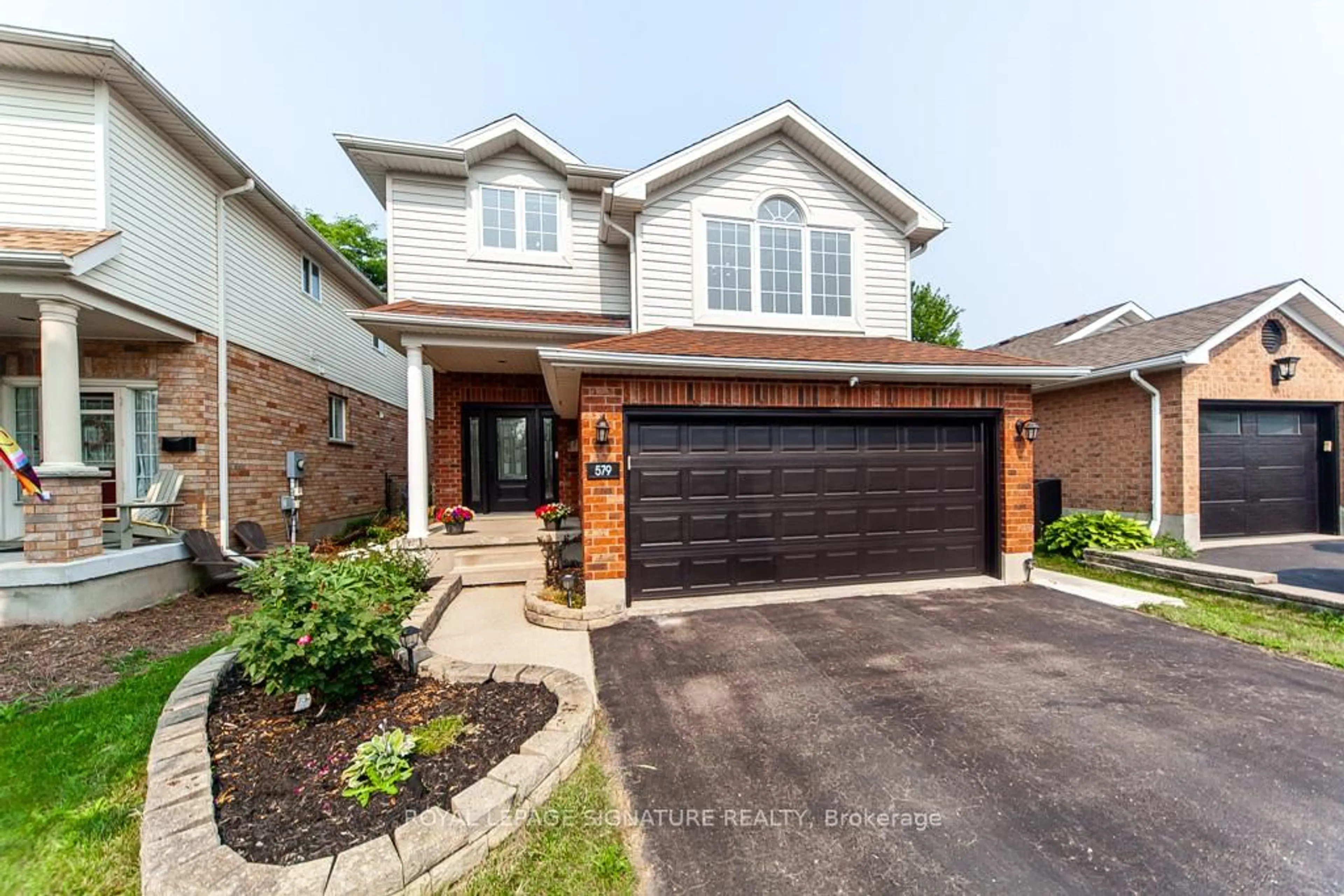 Home with brick exterior material, street for 579 Windjammer Way, Waterloo Ontario N2K 3Z6