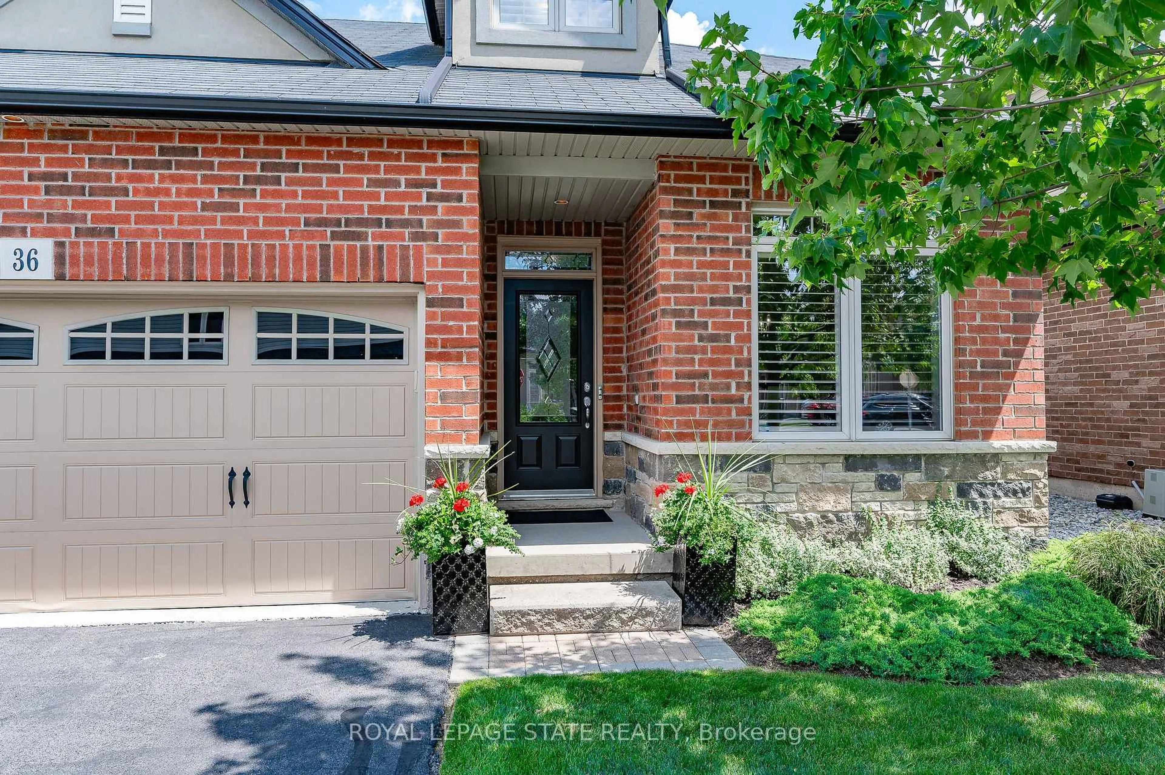 Home with brick exterior material, street for 36 Toulon Ave, Hamilton Ontario L9K 0E5