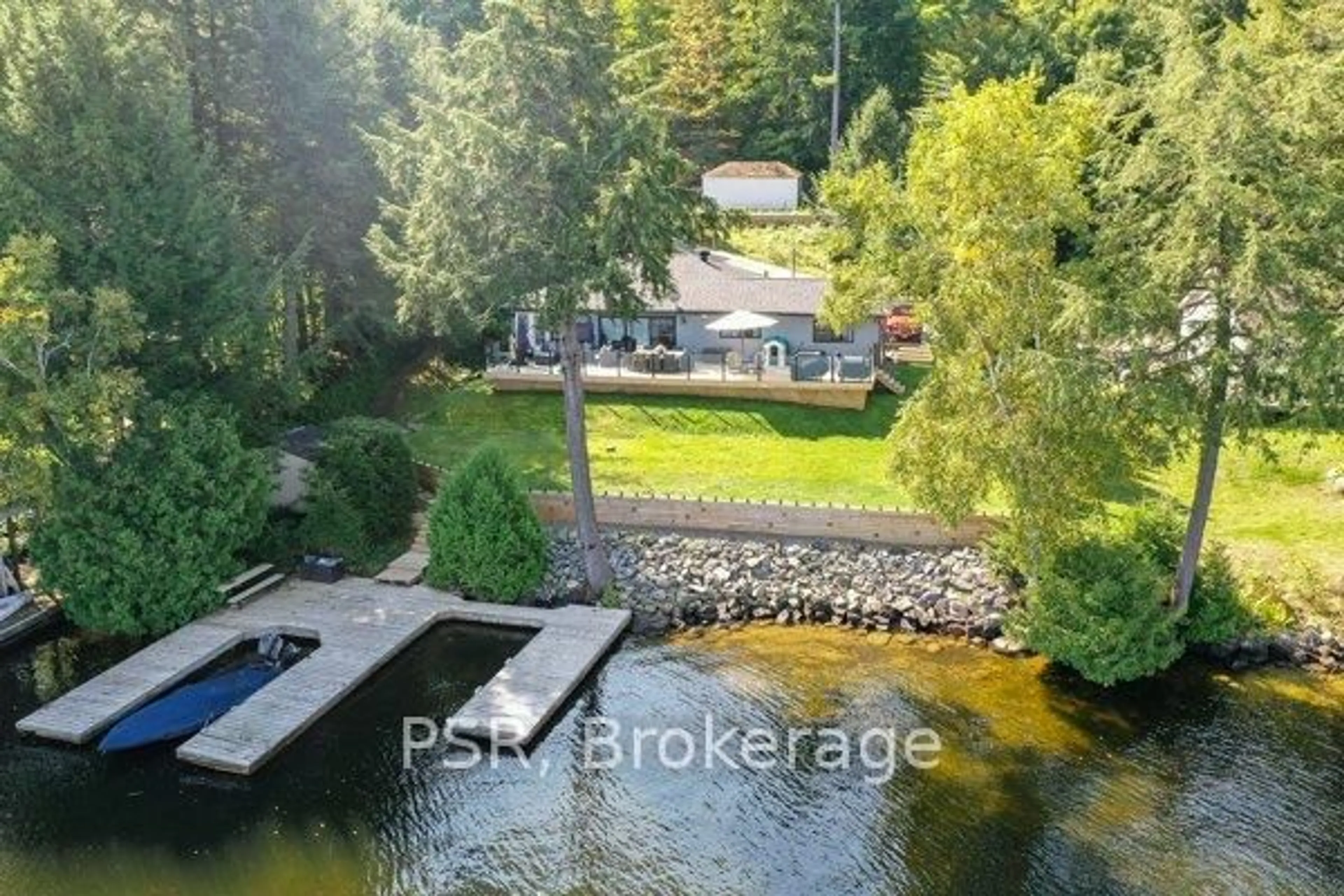 A pic from outside/outdoor area/front of a property/back of a property/a pic from drone, water/lake/river/ocean view for 1018 Georgina Way #1, Gravenhurst Ontario P1P 1R2