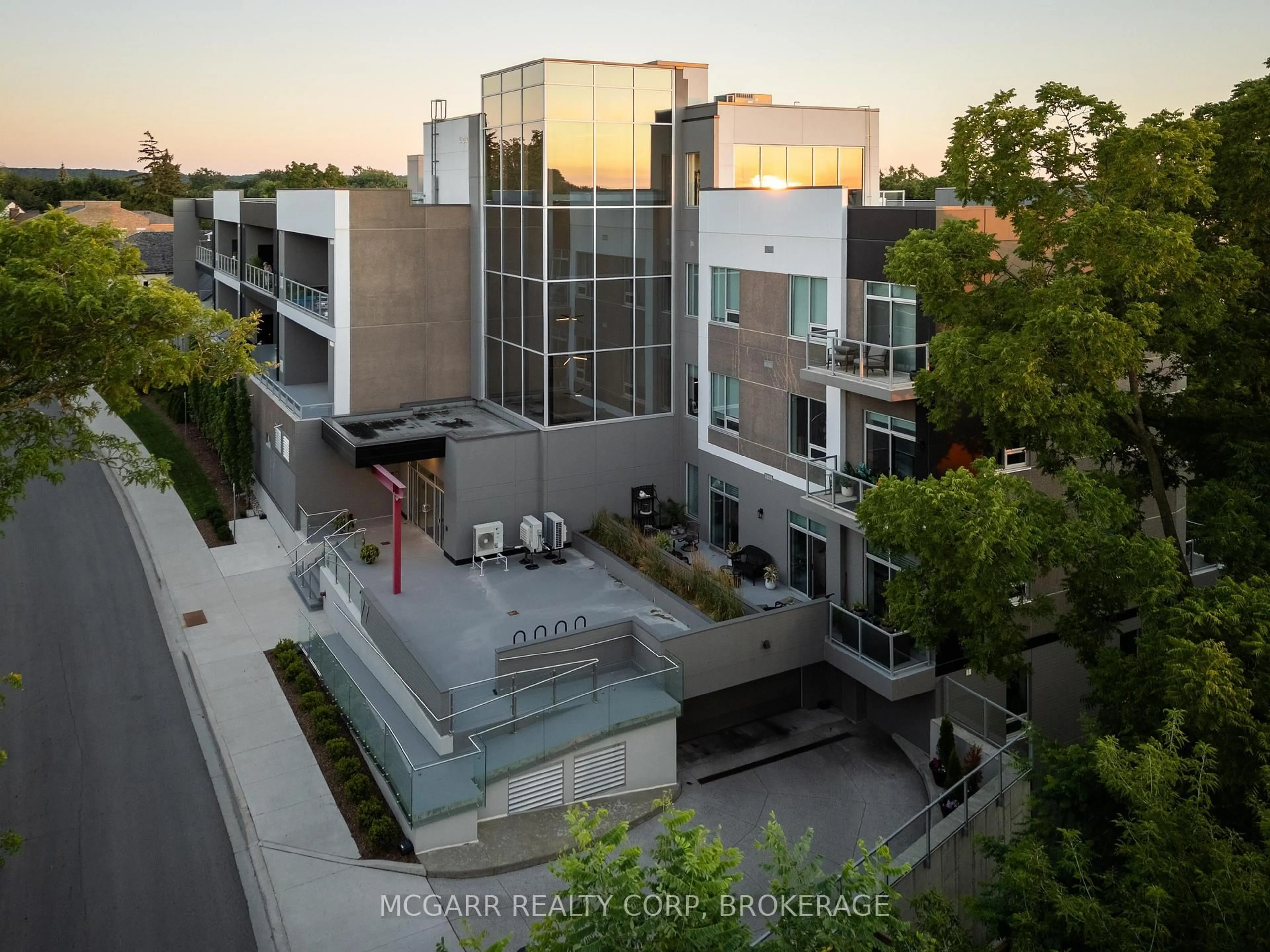 A pic from outside/outdoor area/front of a property/back of a property/a pic from drone, city buildings view from balcony for 77 Yates St #203, St. Catharines Ontario L2R 5R7