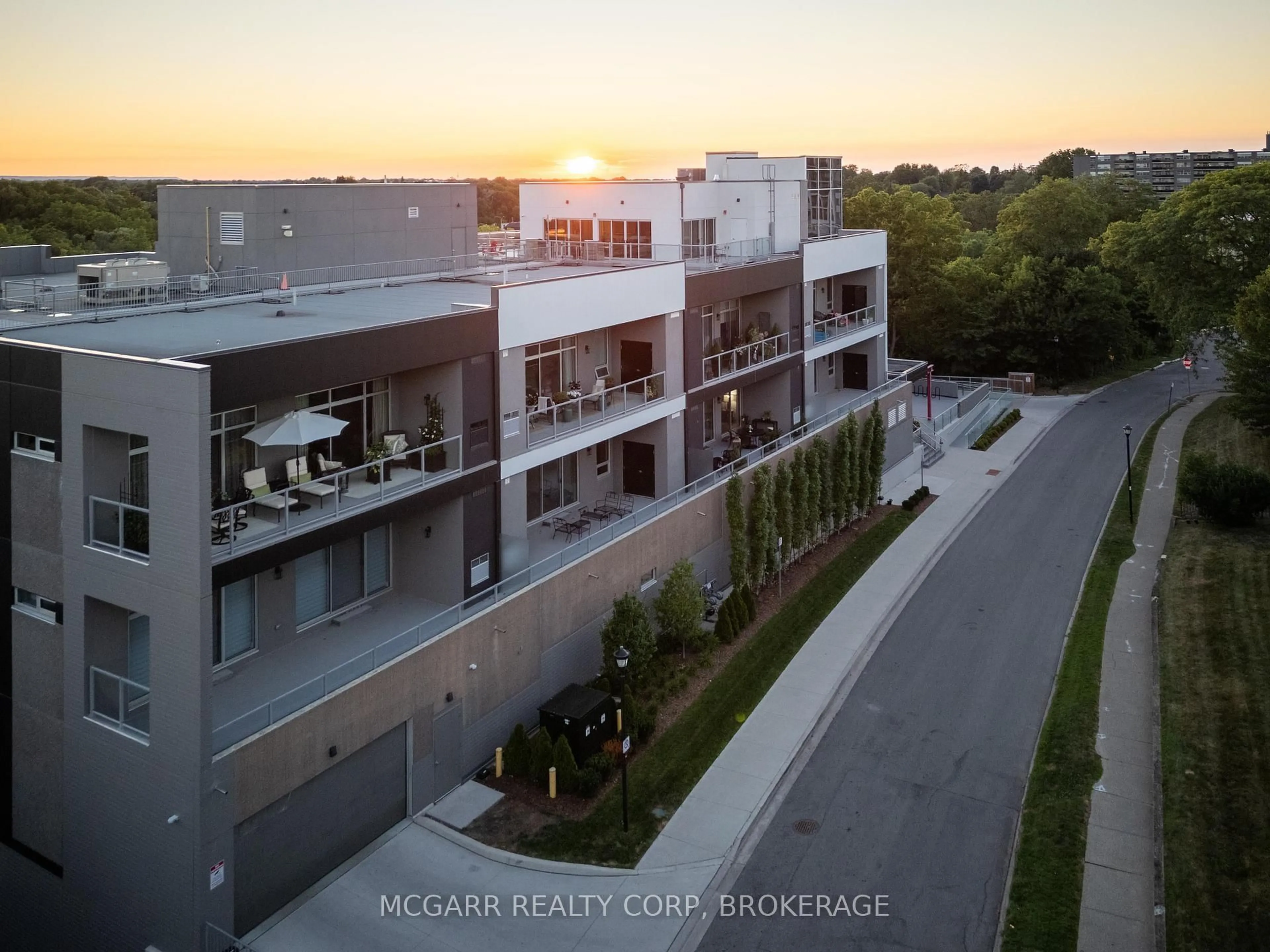A pic from outside/outdoor area/front of a property/back of a property/a pic from drone, city buildings view from balcony for 77 Yates St #203, St. Catharines Ontario L2R 5R7