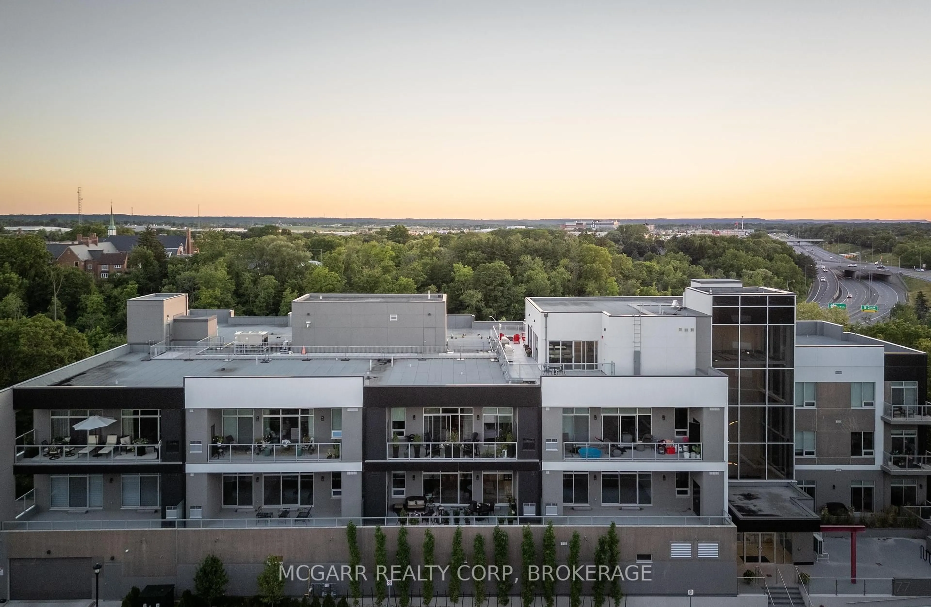 A pic from outside/outdoor area/front of a property/back of a property/a pic from drone, city buildings view from balcony for 77 Yates St #203, St. Catharines Ontario L2R 5R7