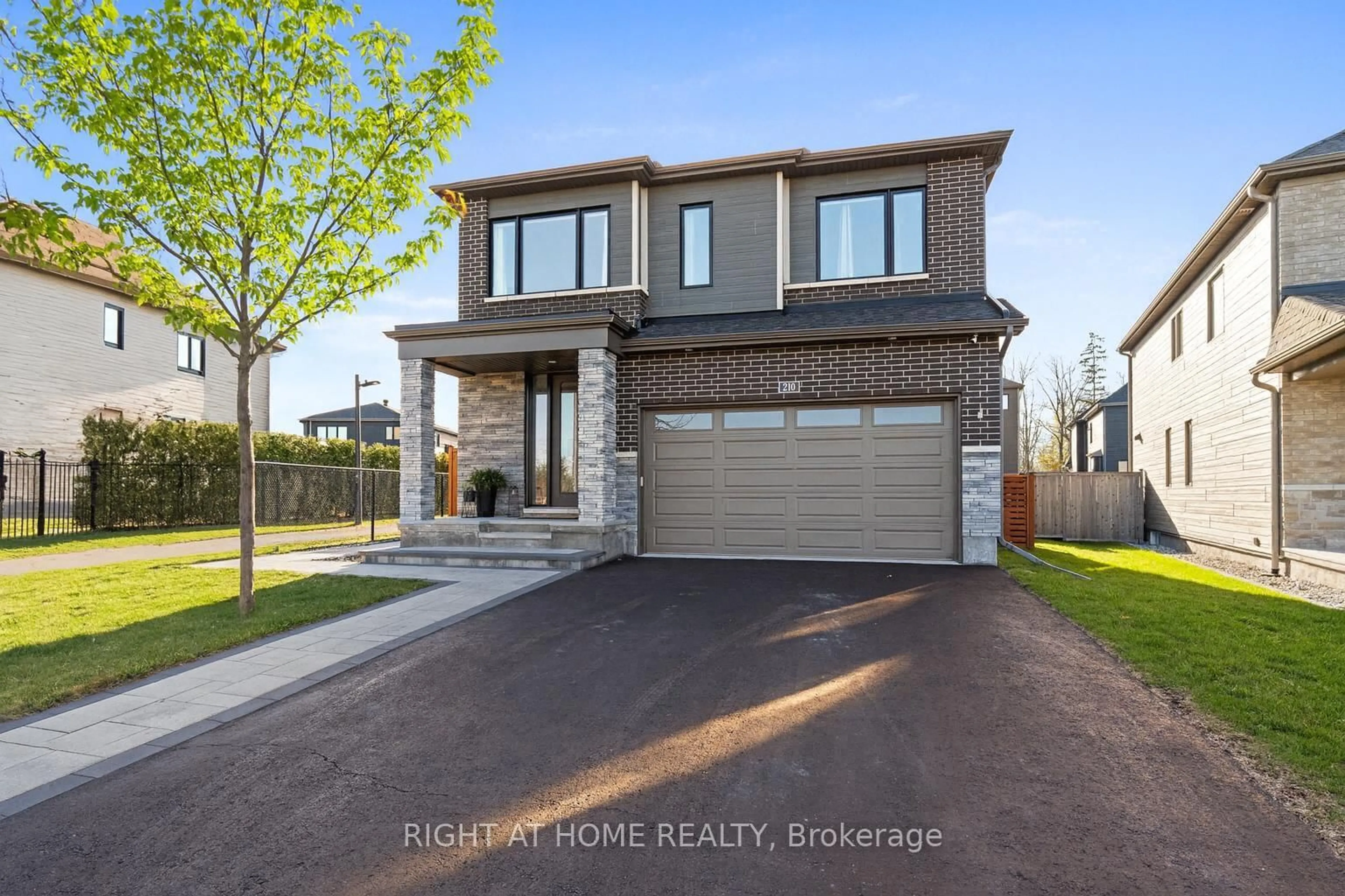 Home with brick exterior material, street for 210 Spindrift Circ, Manotick Ontario K4M 1J8