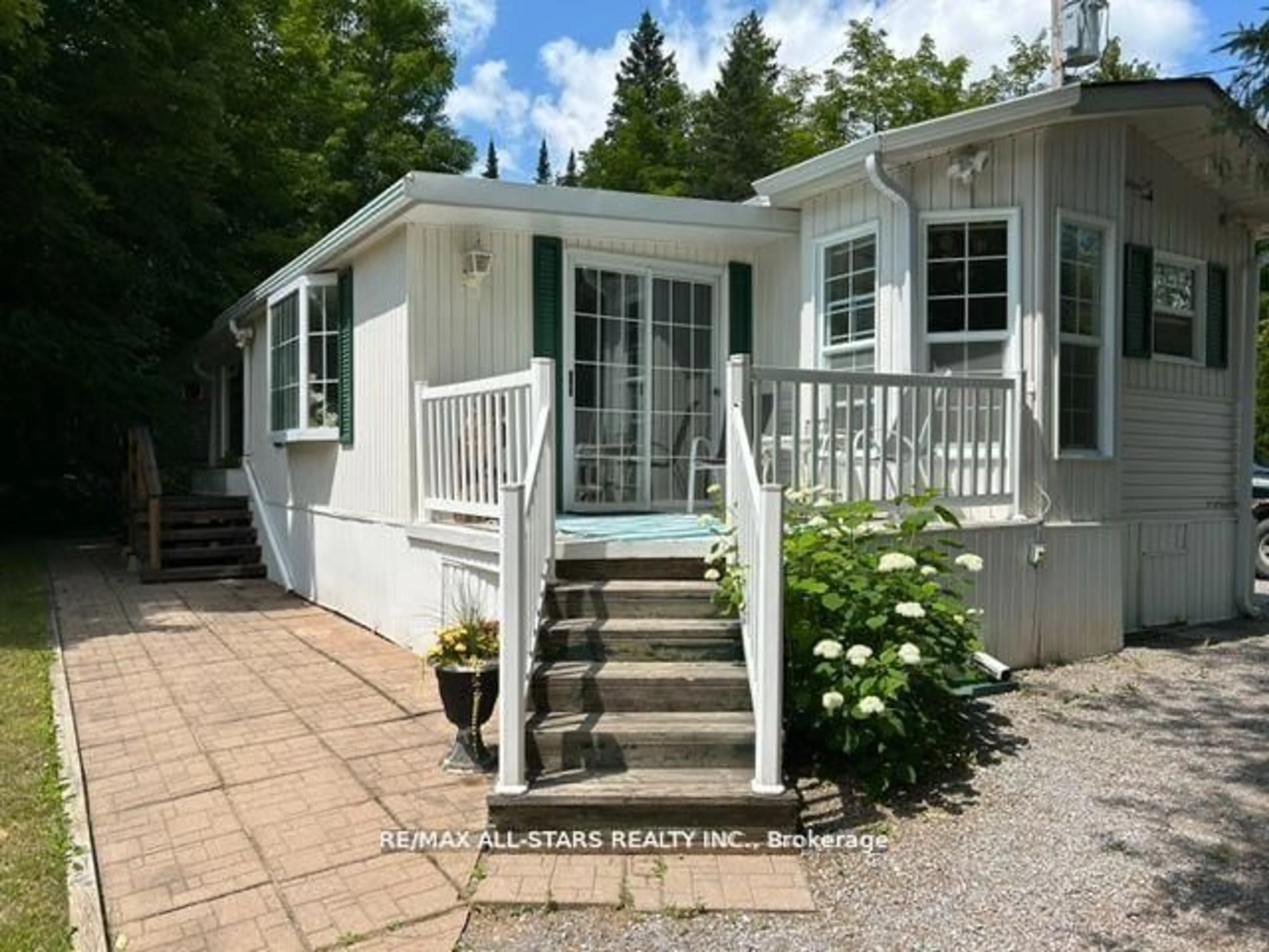 Home with vinyl exterior material, street for 1802 County Rd 121 #LOT 312, Kawartha Lakes Ontario K0M 1N0
