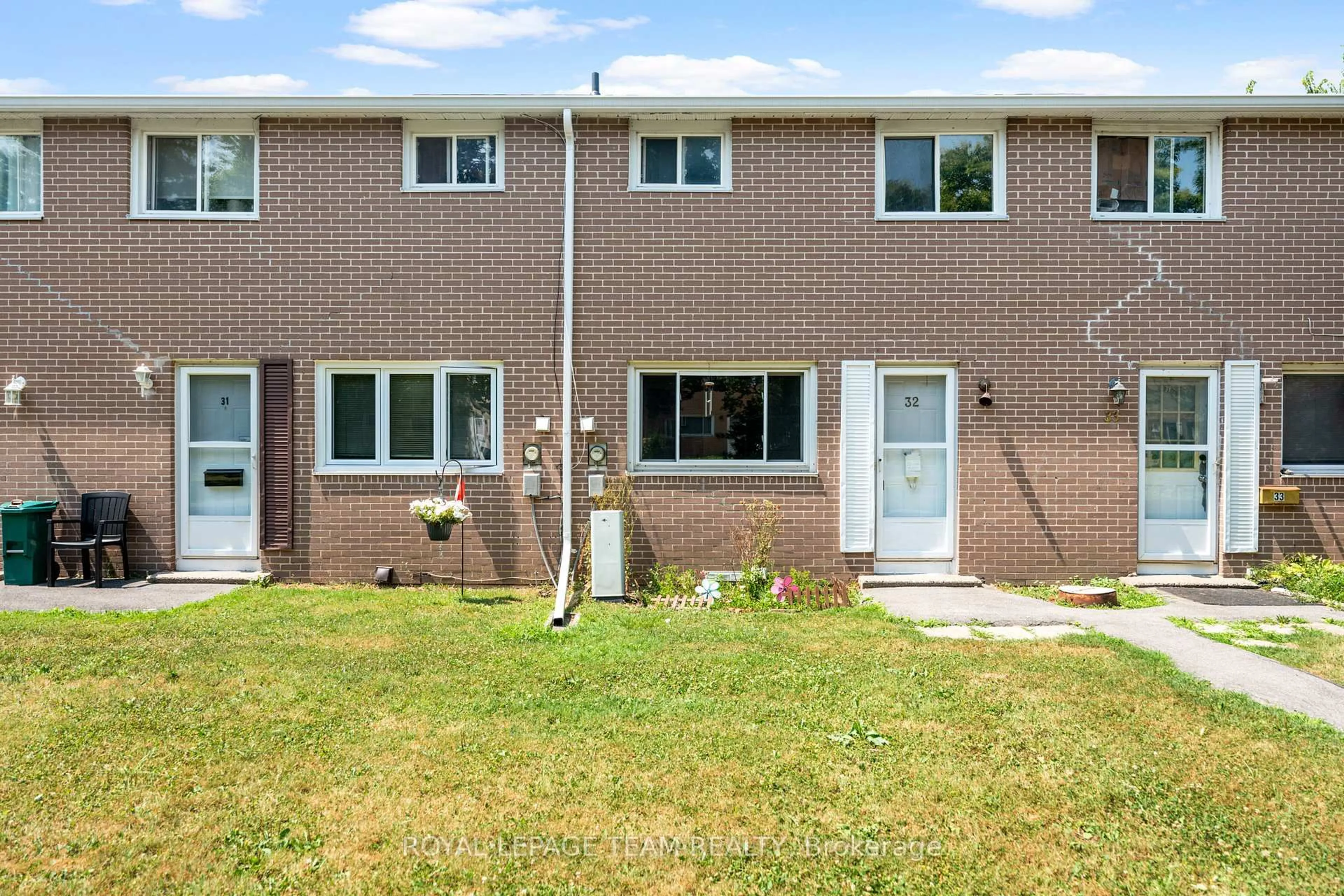 Home with brick exterior material, street for 258 Queen Mary Rd #32, Kingston Ontario K7M 2B2