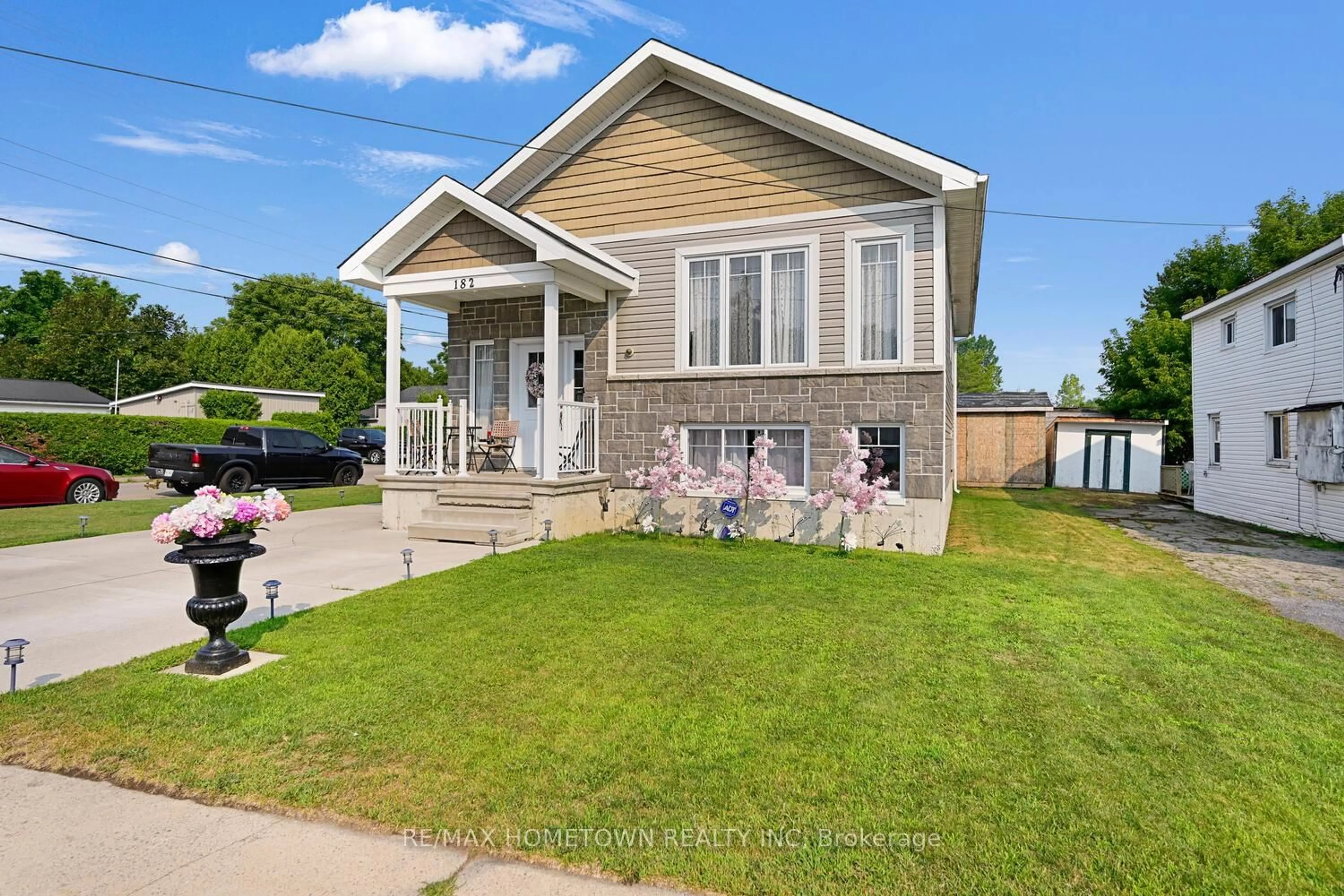 Home with vinyl exterior material, street for 182 Wood St, Prescott Ontario K0E 1T0