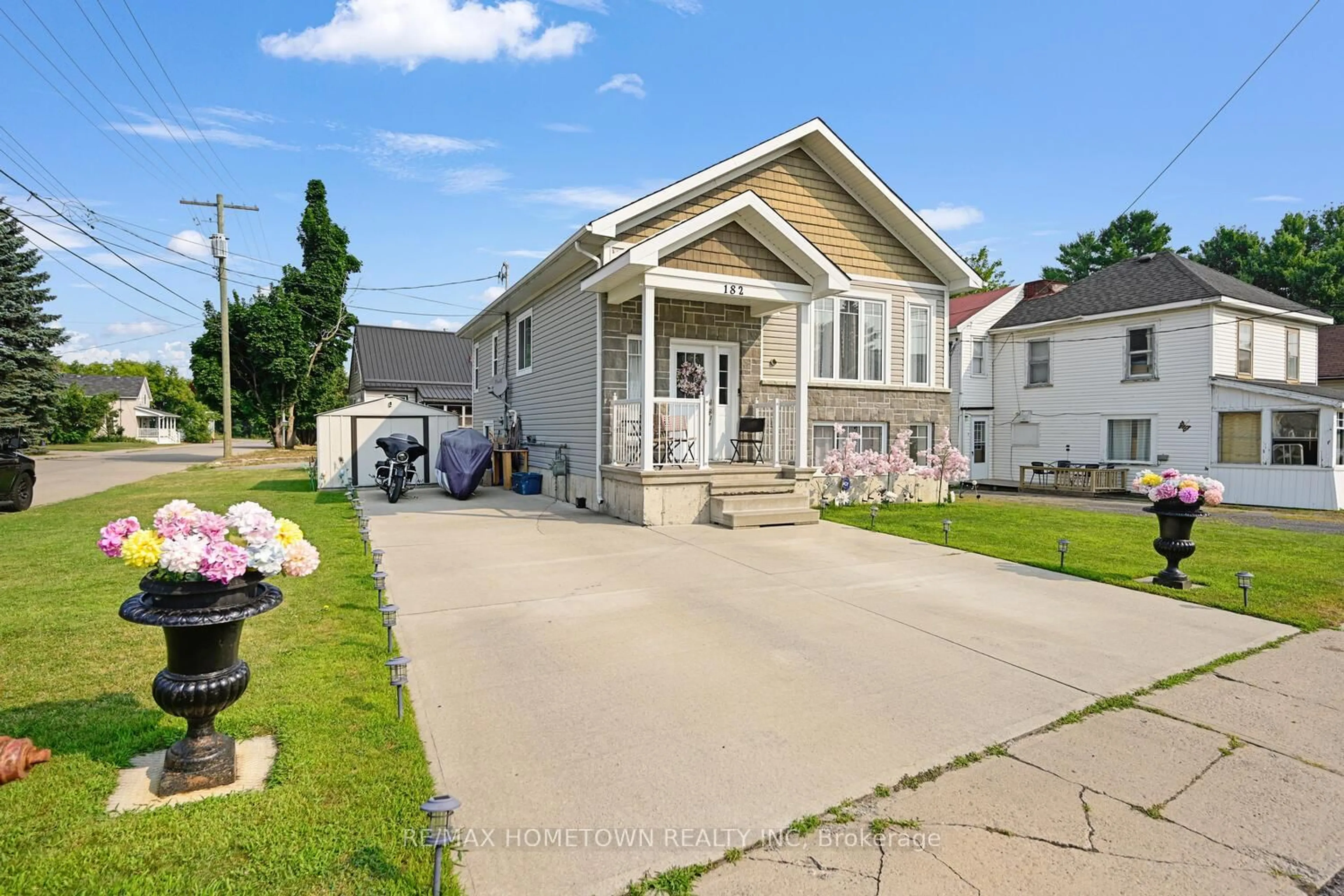 Home with vinyl exterior material, street for 182 Wood St, Prescott Ontario K0E 1T0