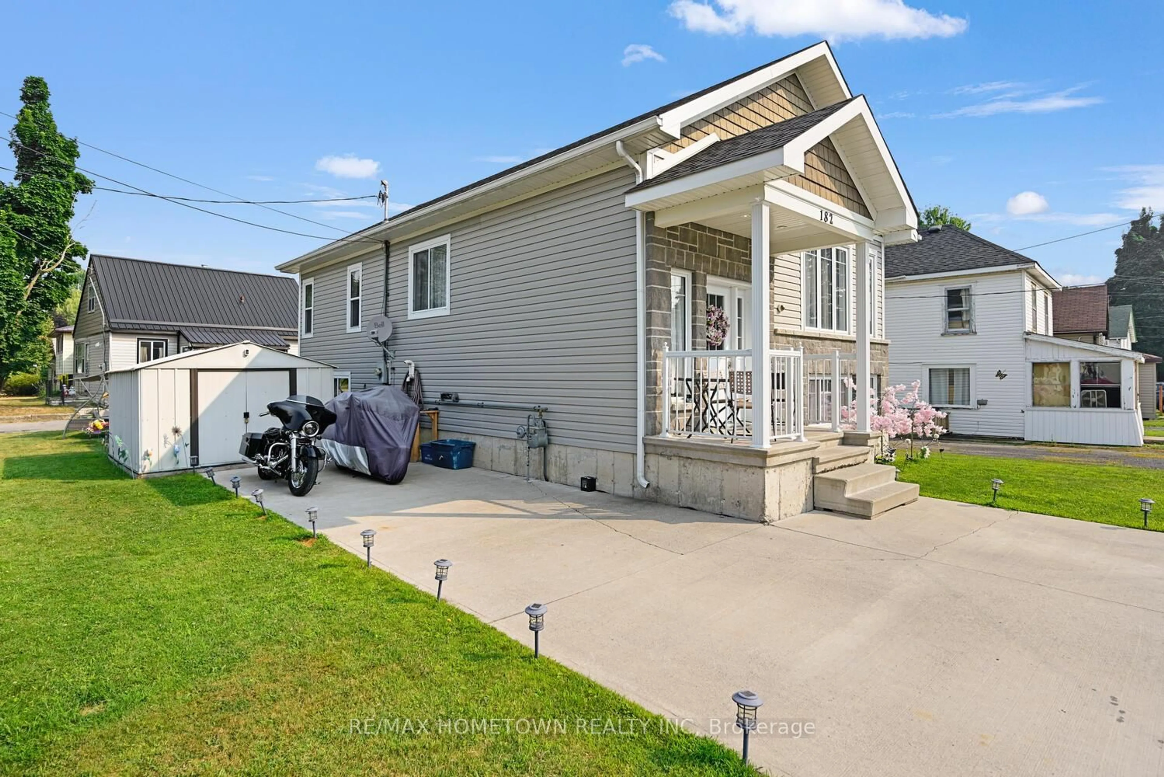 Home with vinyl exterior material, street for 182 Wood St, Prescott Ontario K0E 1T0