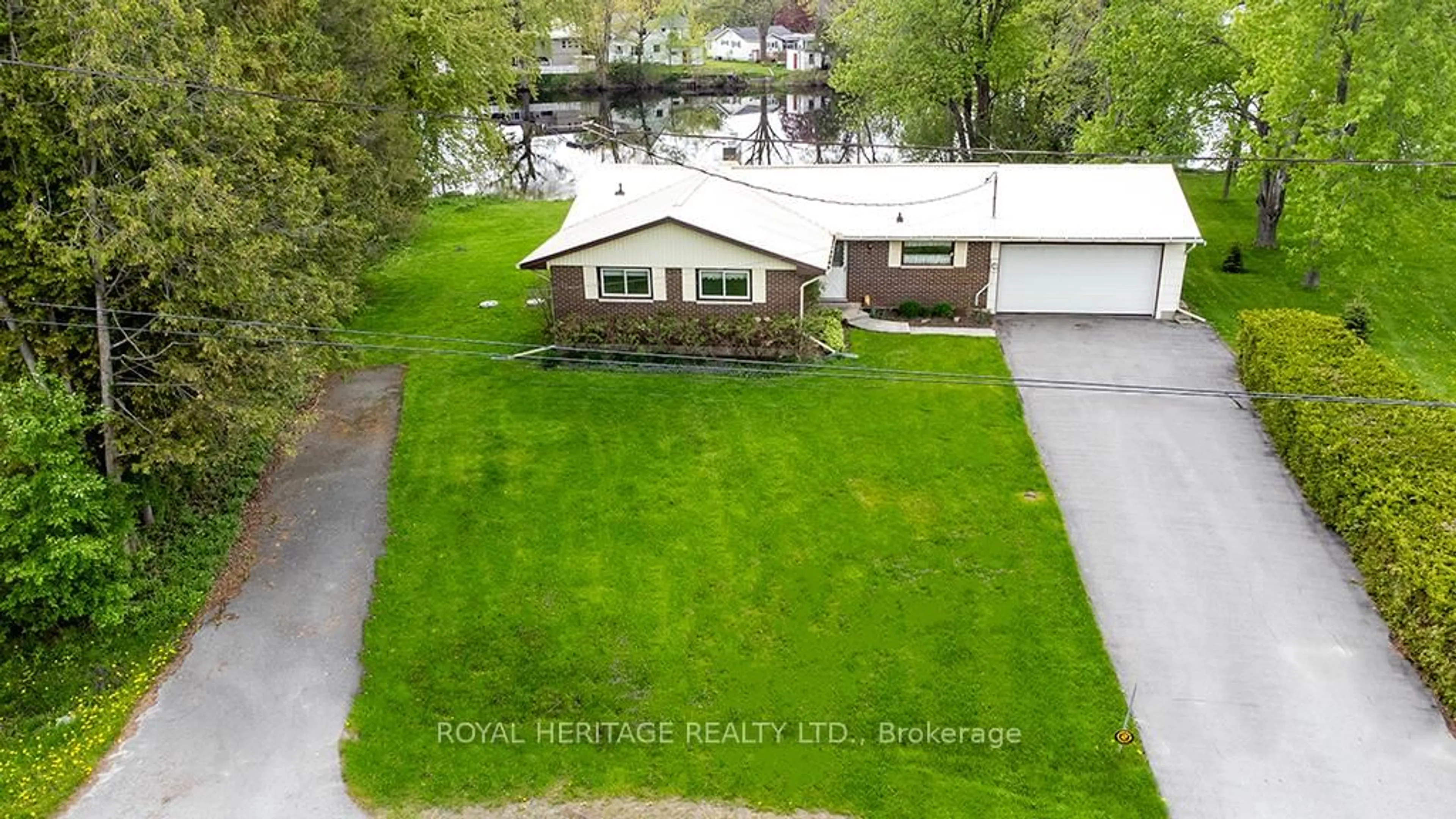 A pic from outside/outdoor area/front of a property/back of a property/a pic from drone, water/lake/river/ocean view for 80 Greenfield Park, Corbyville Ontario K0K 1V0