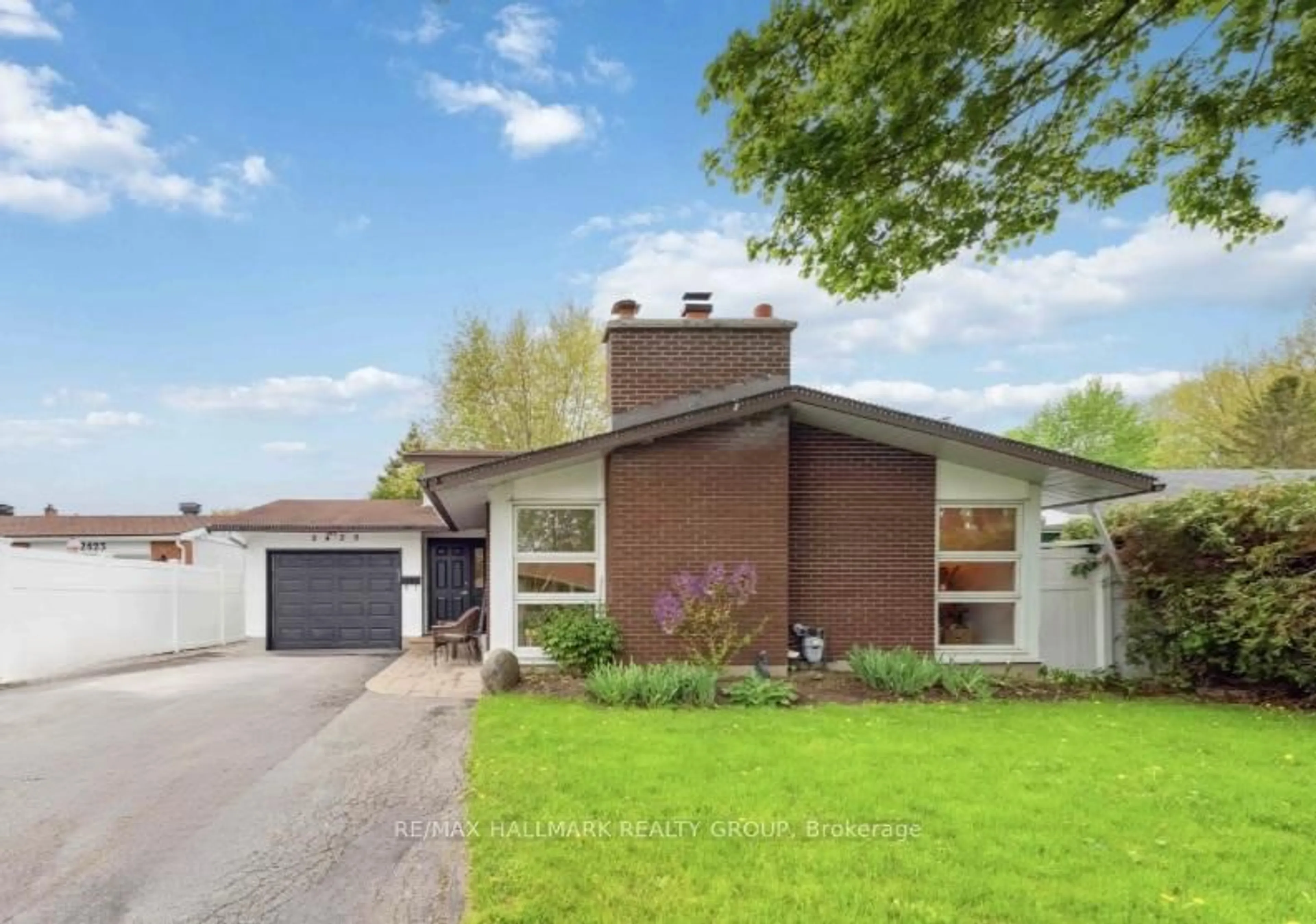 Home with brick exterior material, street for 2425 Ogilvie Rd, Ottawa Ontario K1J 7N3