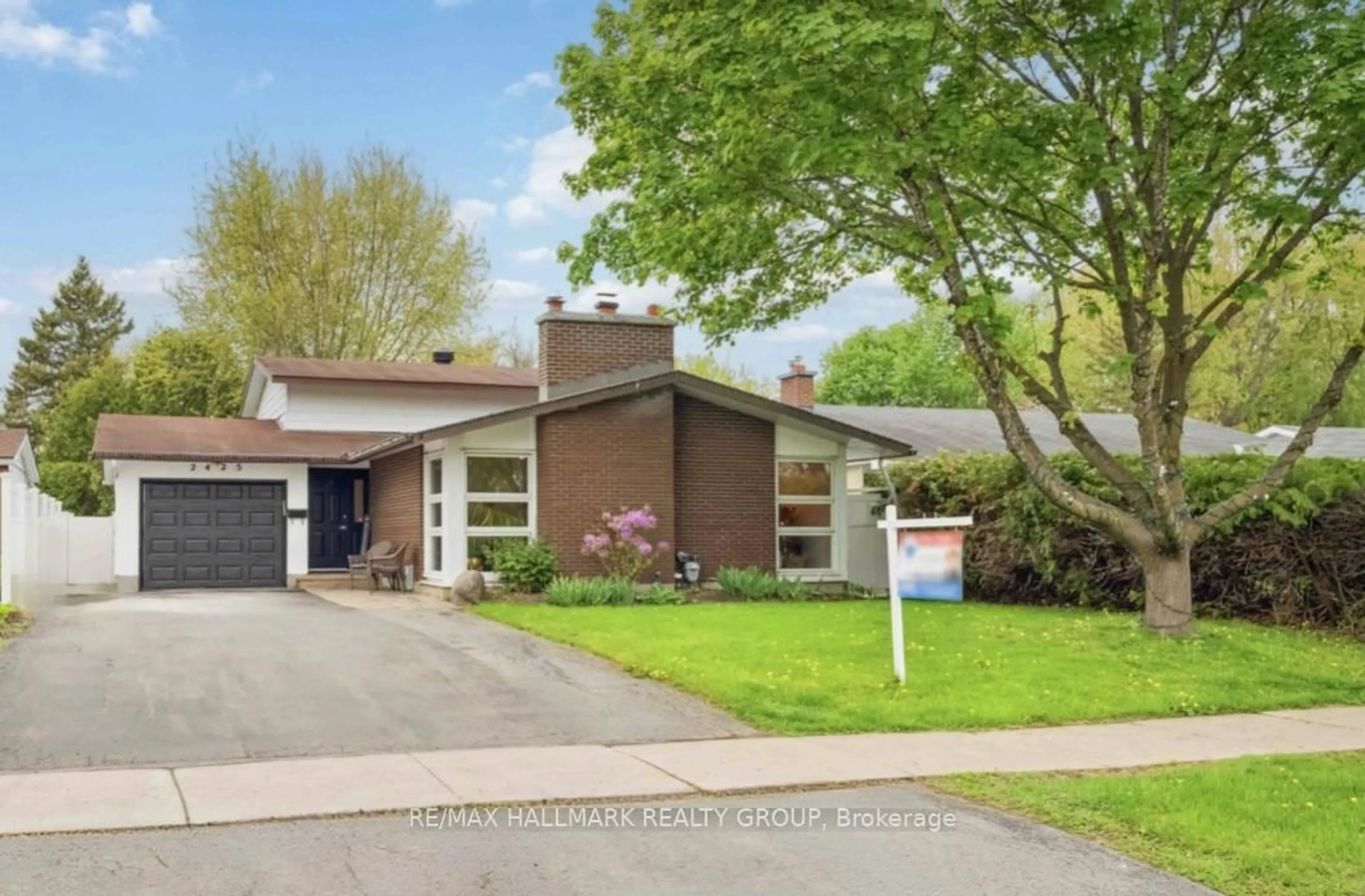 Home with brick exterior material, street for 2425 Ogilvie Rd, Ottawa Ontario K1J 7N3