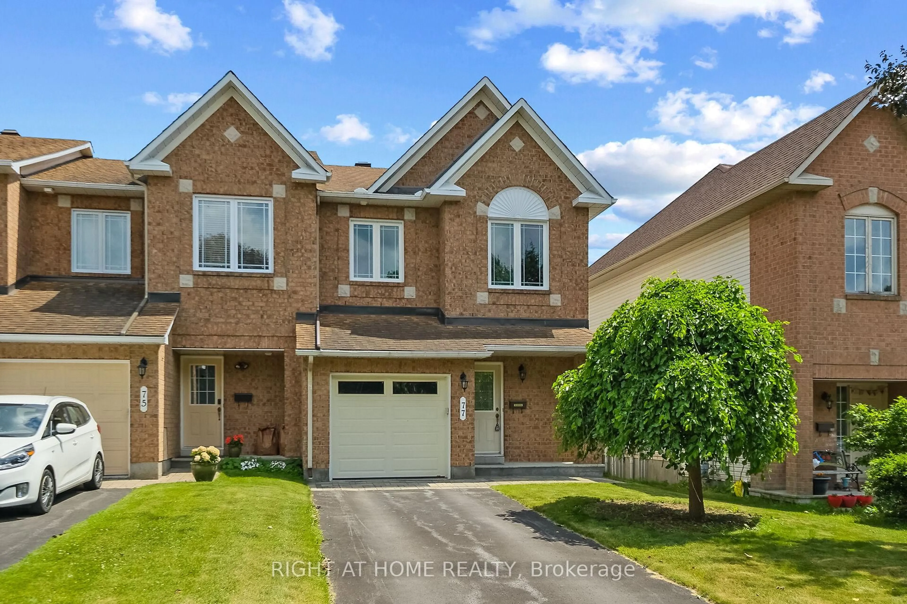 Home with brick exterior material, street for 77 Flowertree Cres, Ottawa Ontario K2M 2R7