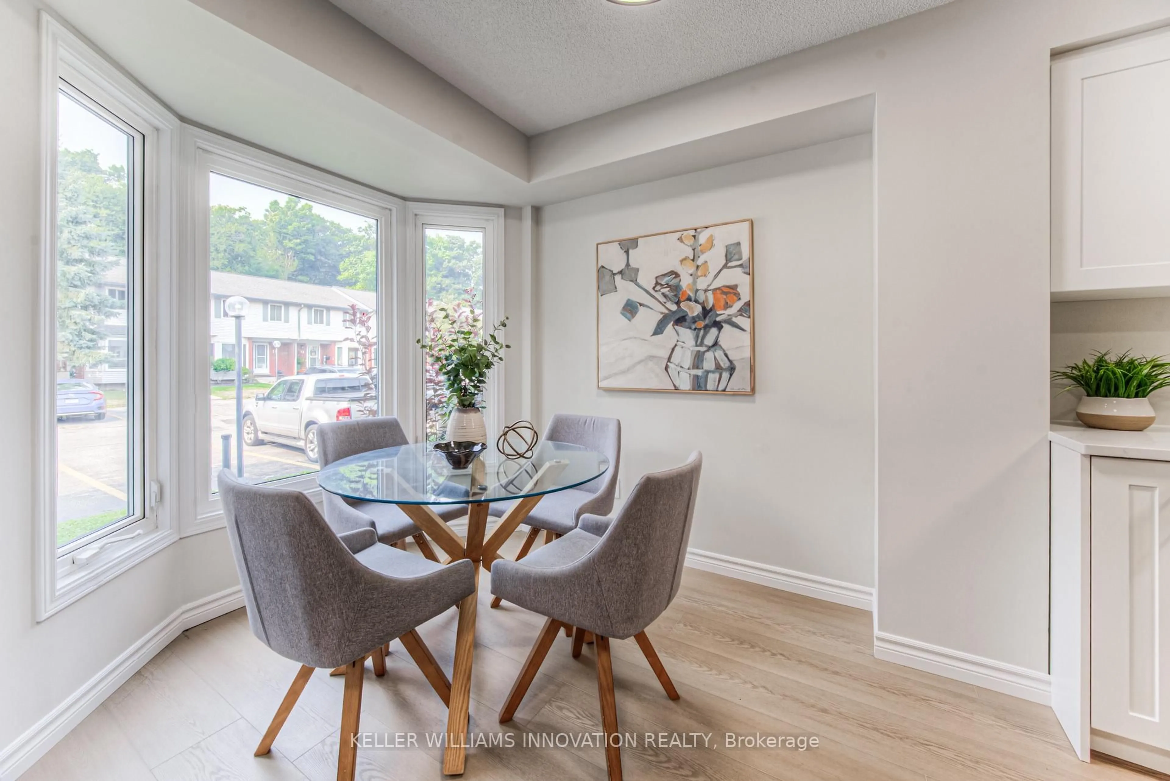 Dining room, wood/laminate floor for 219 Kingswood Dr #5, Kitchener Ontario N2E 3J4