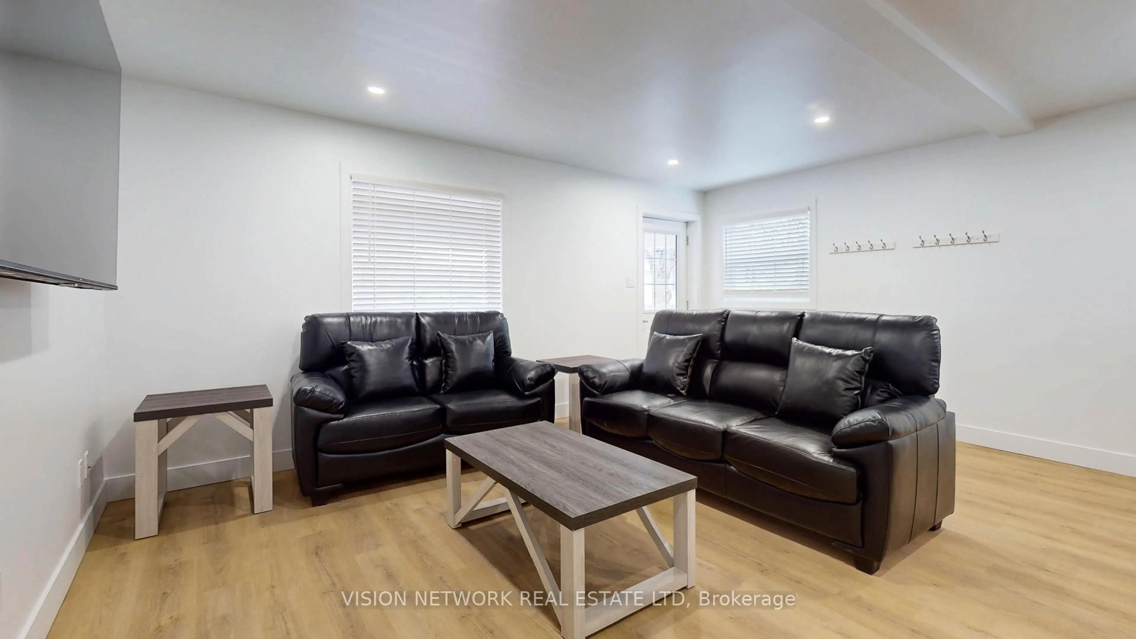 Living room with furniture, wood/laminate floor for 171 Wharncliffe Rd, London North Ontario N6H 2B1