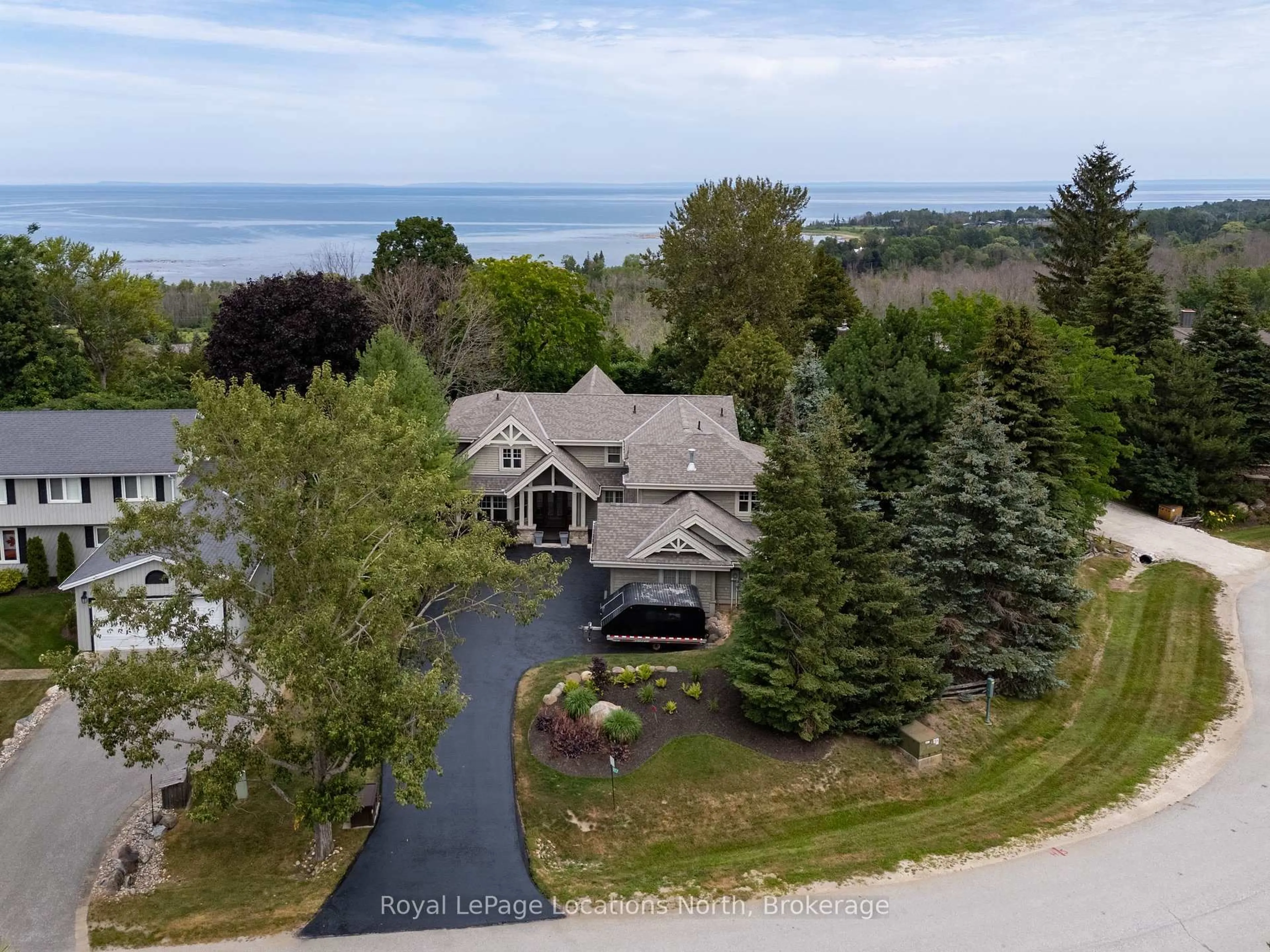 A pic from outside/outdoor area/front of a property/back of a property/a pic from drone, water/lake/river/ocean view for 117 Camperdown Crt, Blue Mountains Ontario N0H 1J0