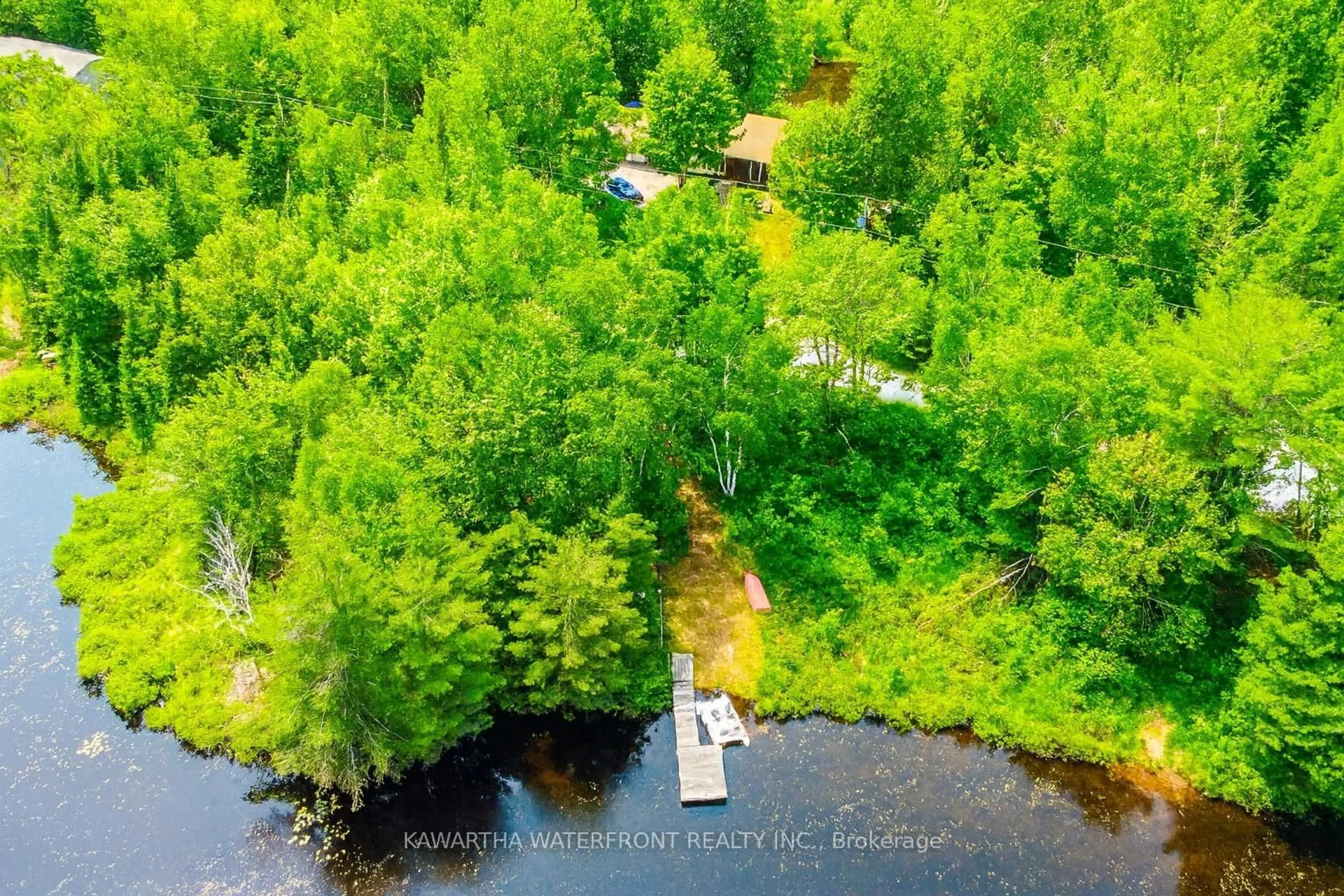 A pic from outside/outdoor area/front of a property/back of a property/a pic from drone, water/lake/river/ocean view for 1170 English Circ, Highlands East Ontario K0M 1R0
