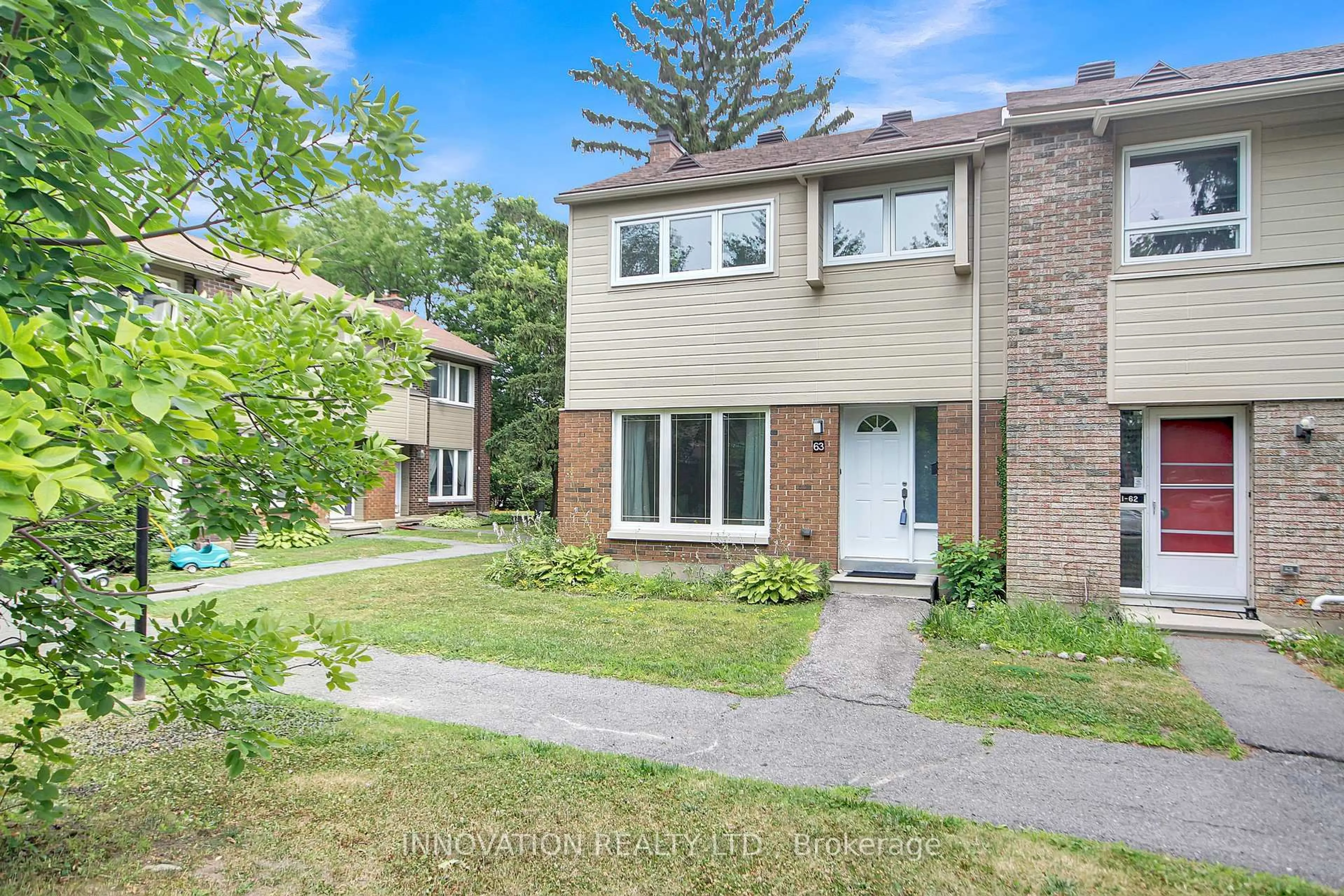 Home with brick exterior material, street for 21 Midland Cres #63, Ottawa Ontario K2H 8P6