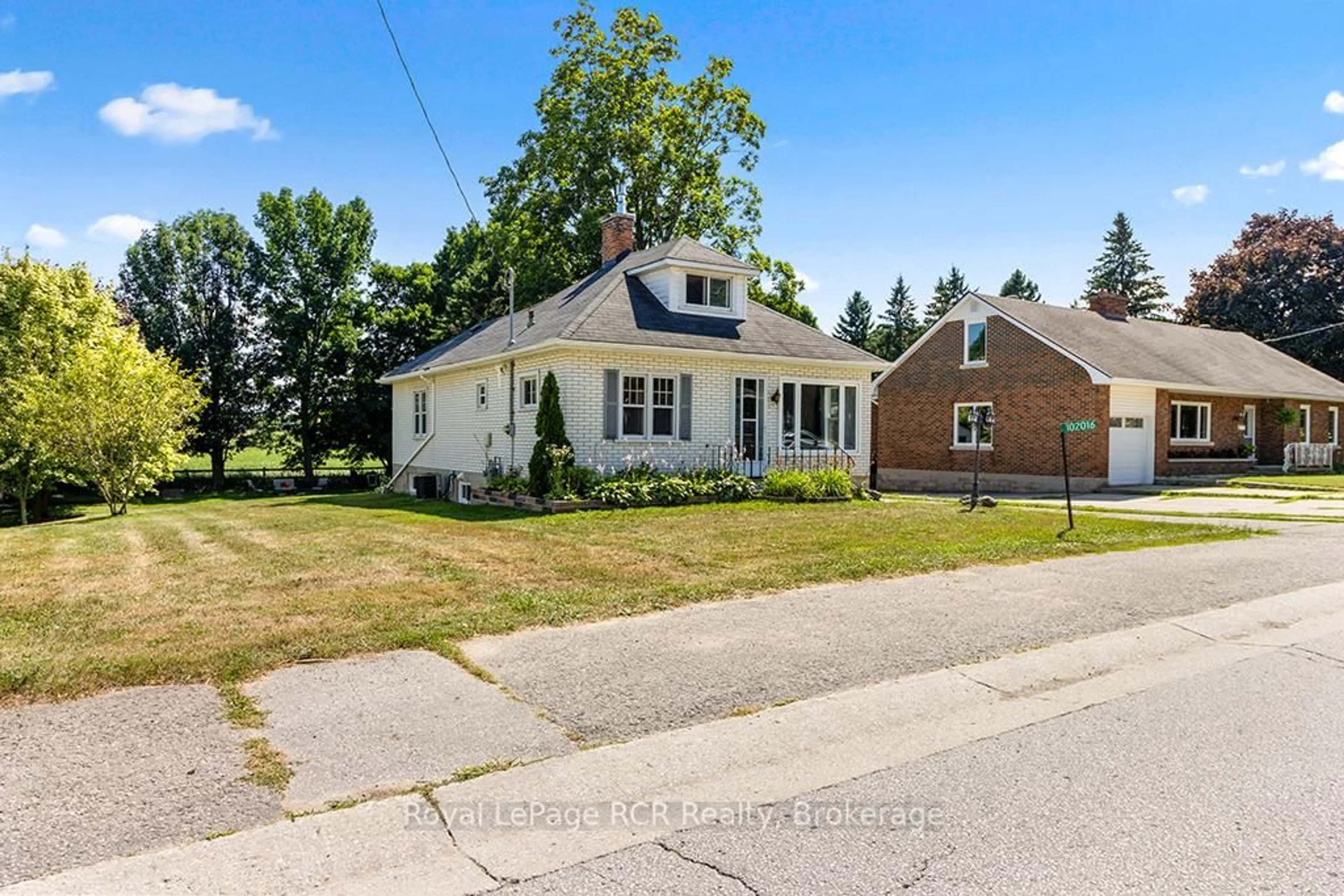 A pic from outside/outdoor area/front of a property/back of a property/a pic from drone, street for 102016 Grey Road 5 Rd, Georgian Bluffs Ontario N4K 5N5