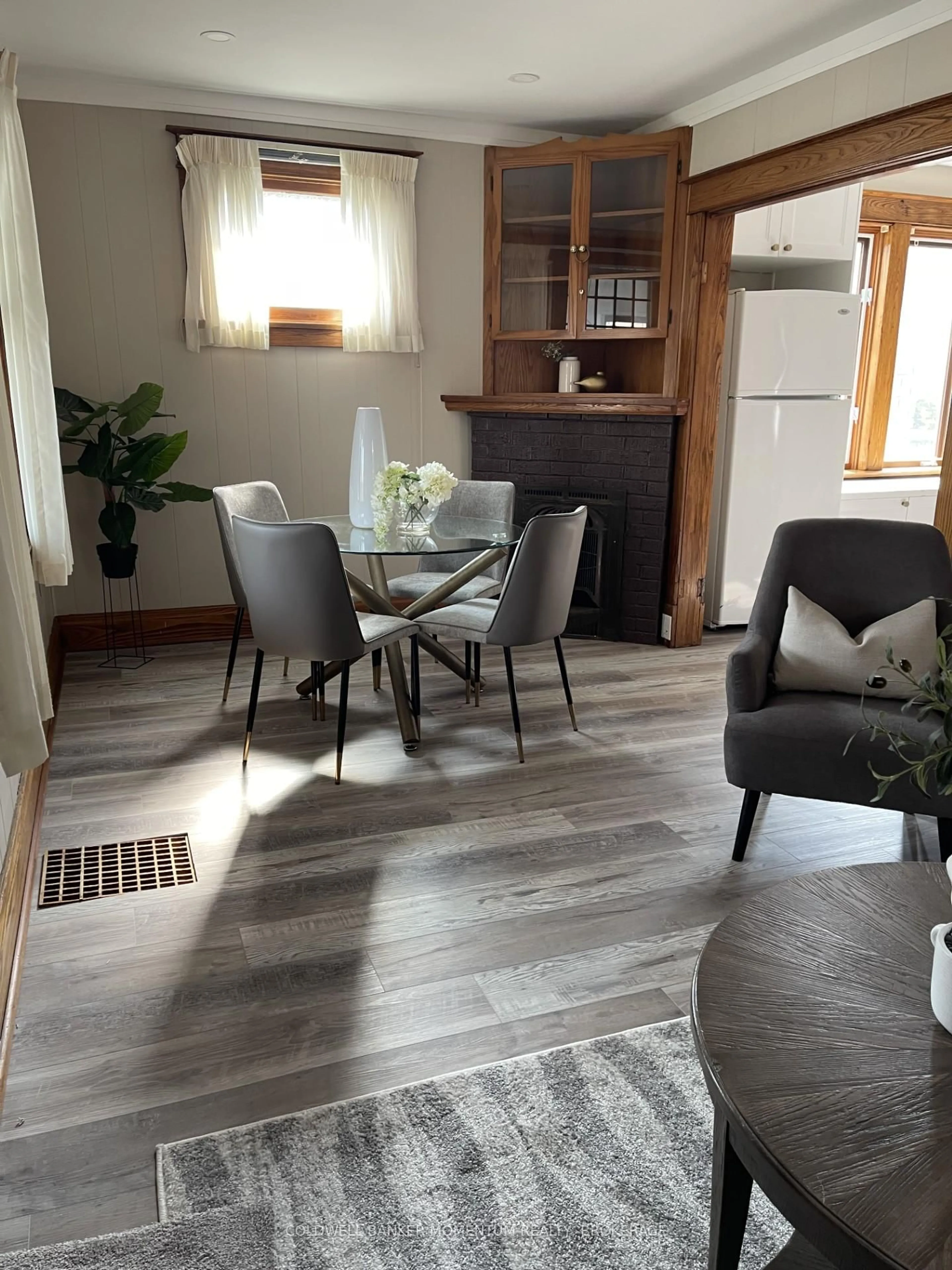 Living room with furniture, wood/laminate floor for 5188 Huron St, Niagara Falls Ontario L2E 2K1